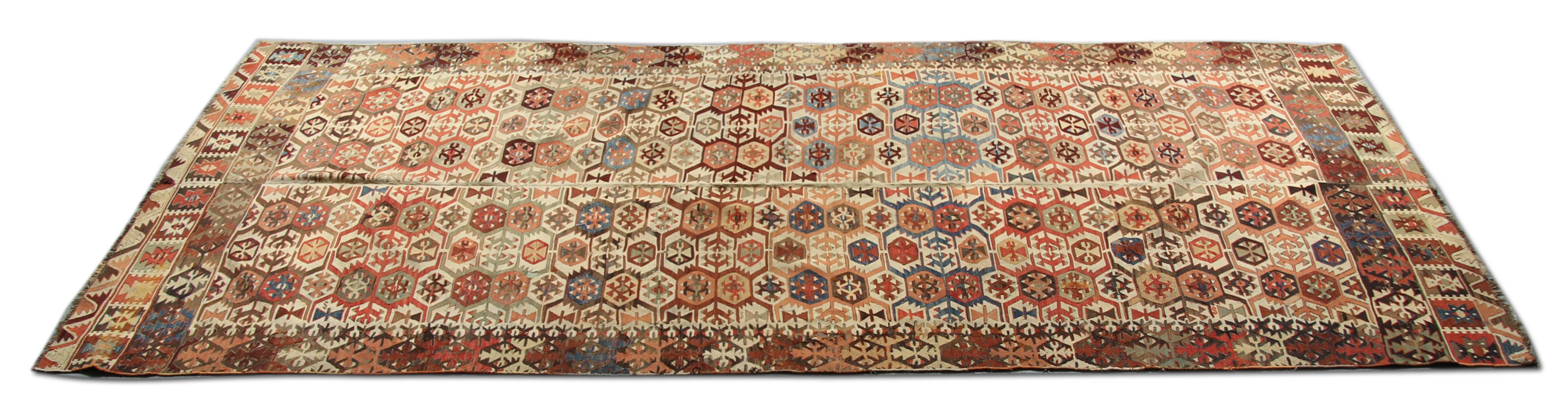 This Antique Turkish Kilim rug is from the area which is called Aydin. Aydin's location near the Mediterranean ensures its importance as a centre for trade. Unfortunately, Aydin, today is an agricultural area where weaving has ceased.  kilims of