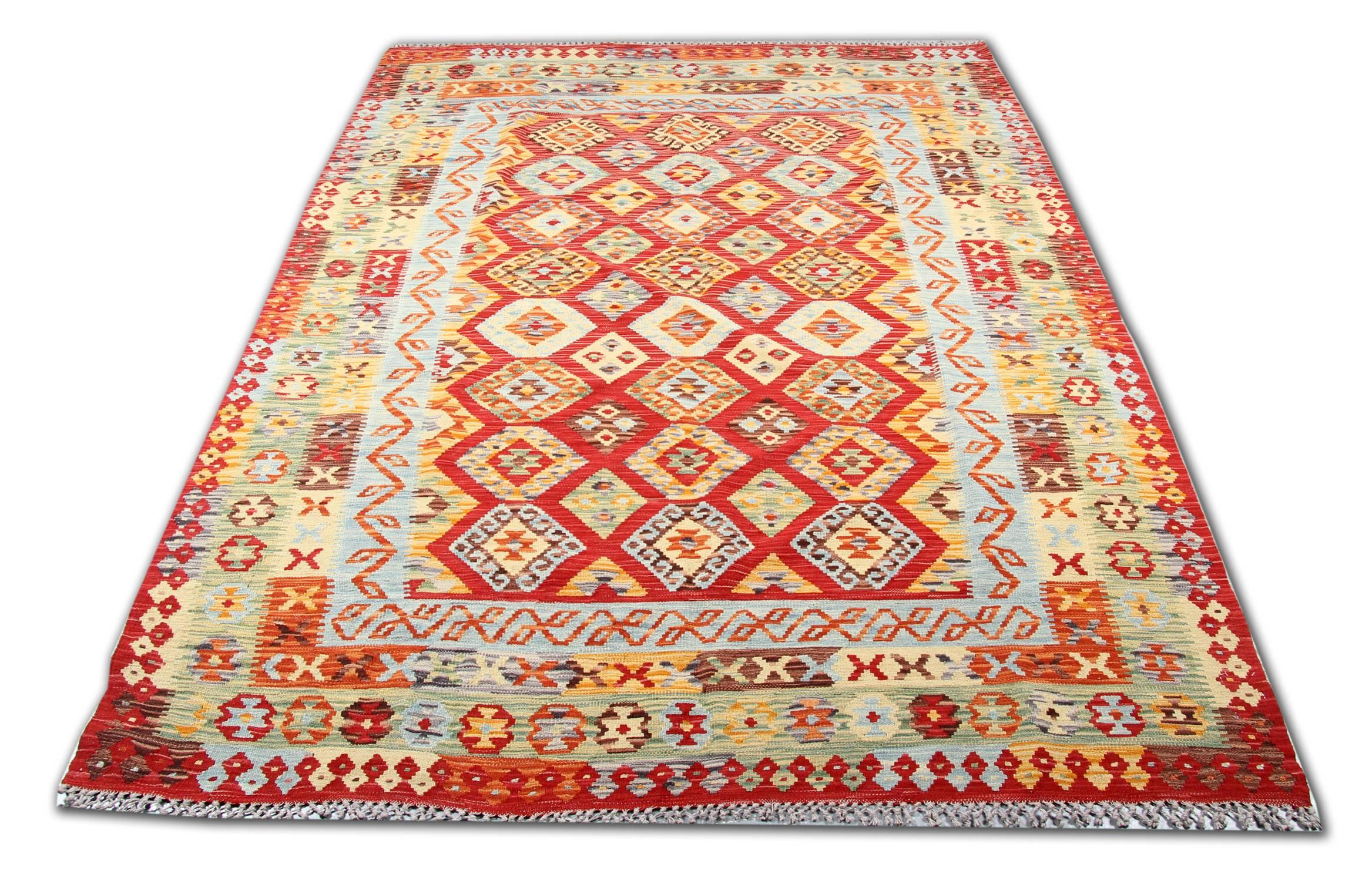 This kilim is handwoven in Afghanistan  by Uzbek and Turkman tribes. The kilim is newly made, but reports the classical designs which originate from the well known Qashqai Persian tribes. The value of the carpet is represented also by its natural