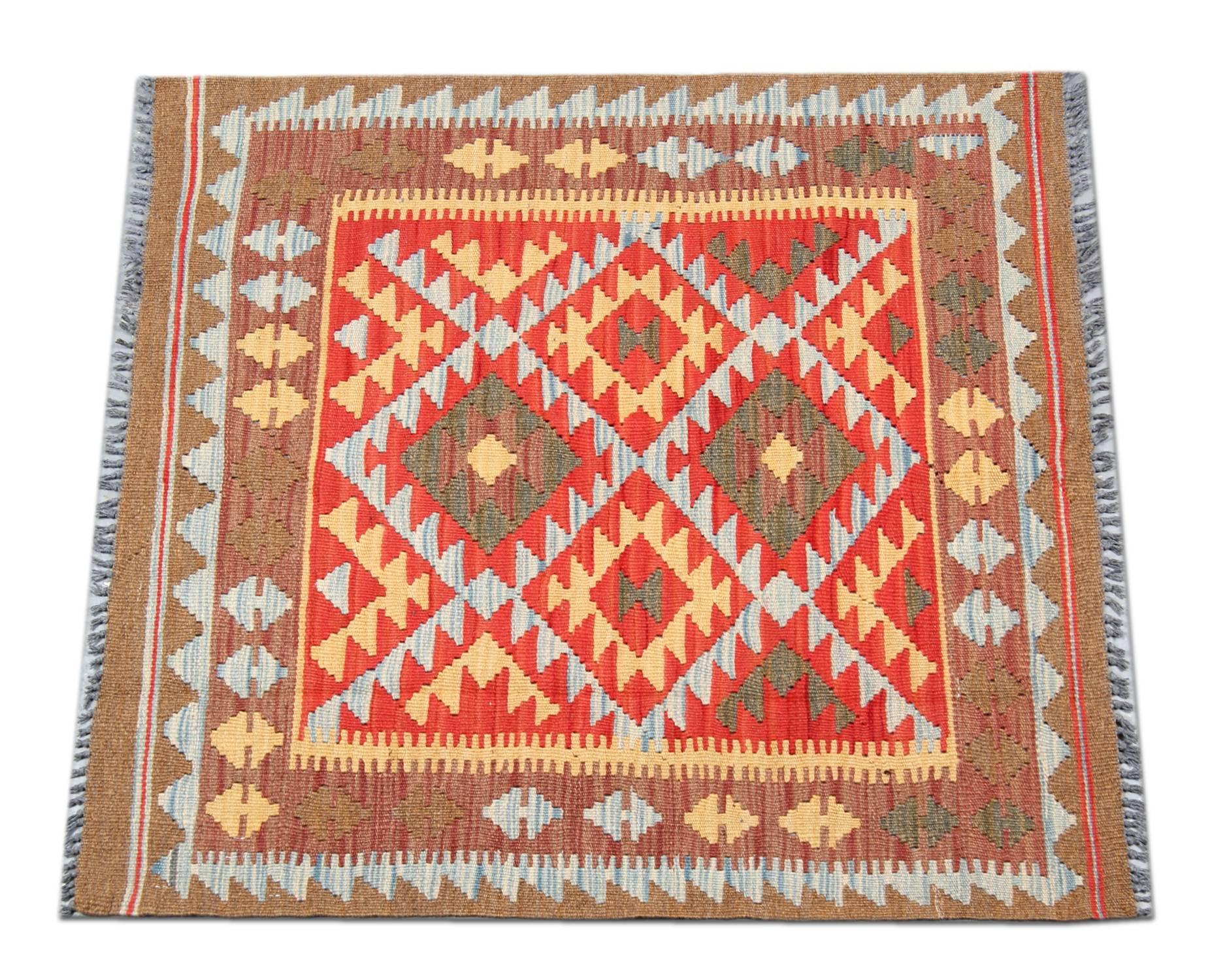This small rug is a Kilim handmade in Afghanistan by Uzbek and Turkman tribes. This flat woven rugs has been made by using the best wool and cotton. Also the dyes are totally organic. The designs derive from the Persian Qashgai tribes. The colors
