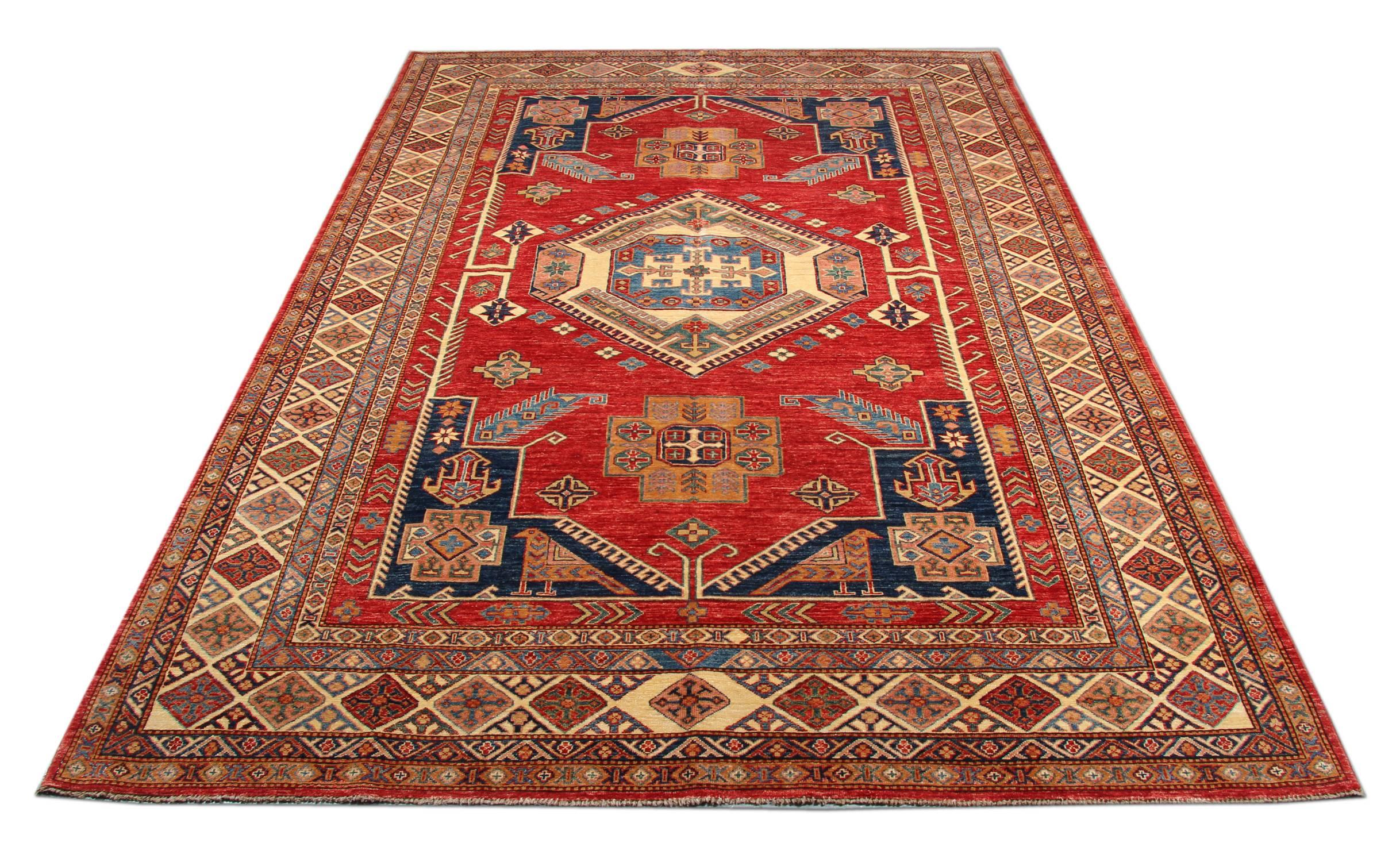 New traditional handwoven Kazak rug with a bold geometric design in red blue and white with a central medallions pattern. Made by hand in wool and cotton.