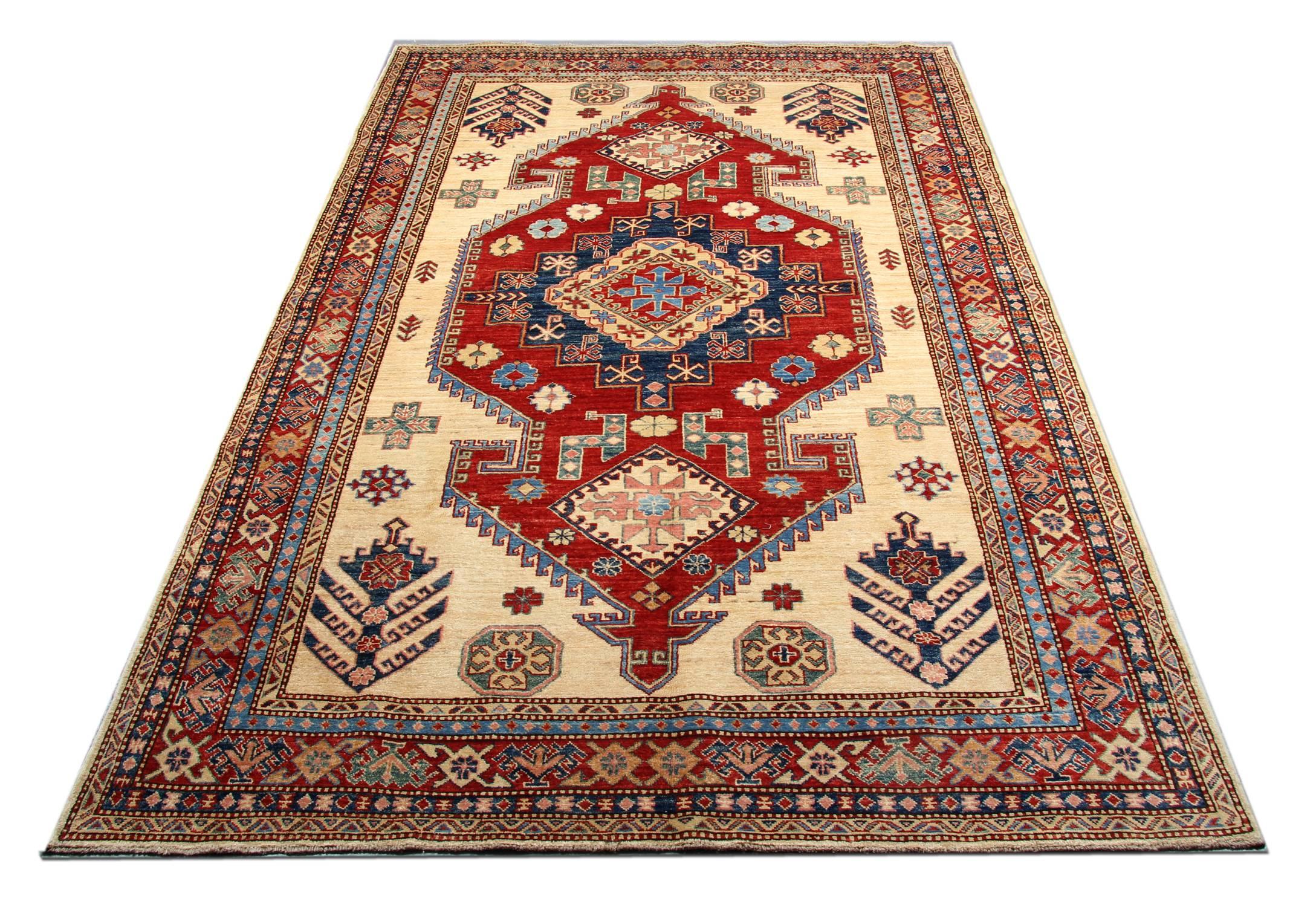Oriental rug Handmade carpet is a traditional handwoven tribal rug with bold colours of cream, light blue and red featuring intricate geometric rug designs of stars and peacocks trees encompassing three medallions. This cream rug is handmade with