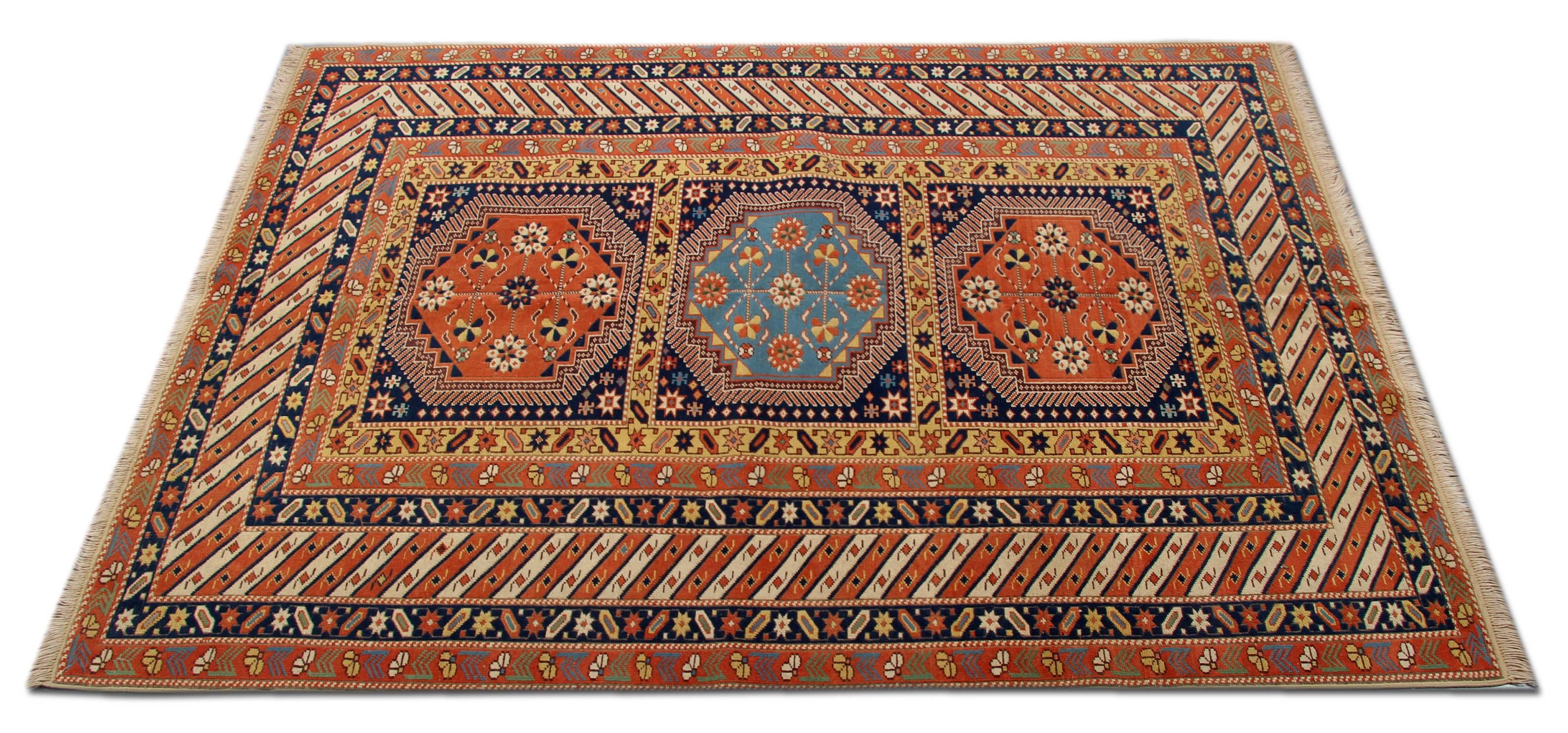 This new traditional woven rug comes in a striking color combination. The tribal rug has bright red, navy, sea blue, cream and caramel colors. This geometric rug has a floral rug design and three similar repeating patterns. The pattern depicted on