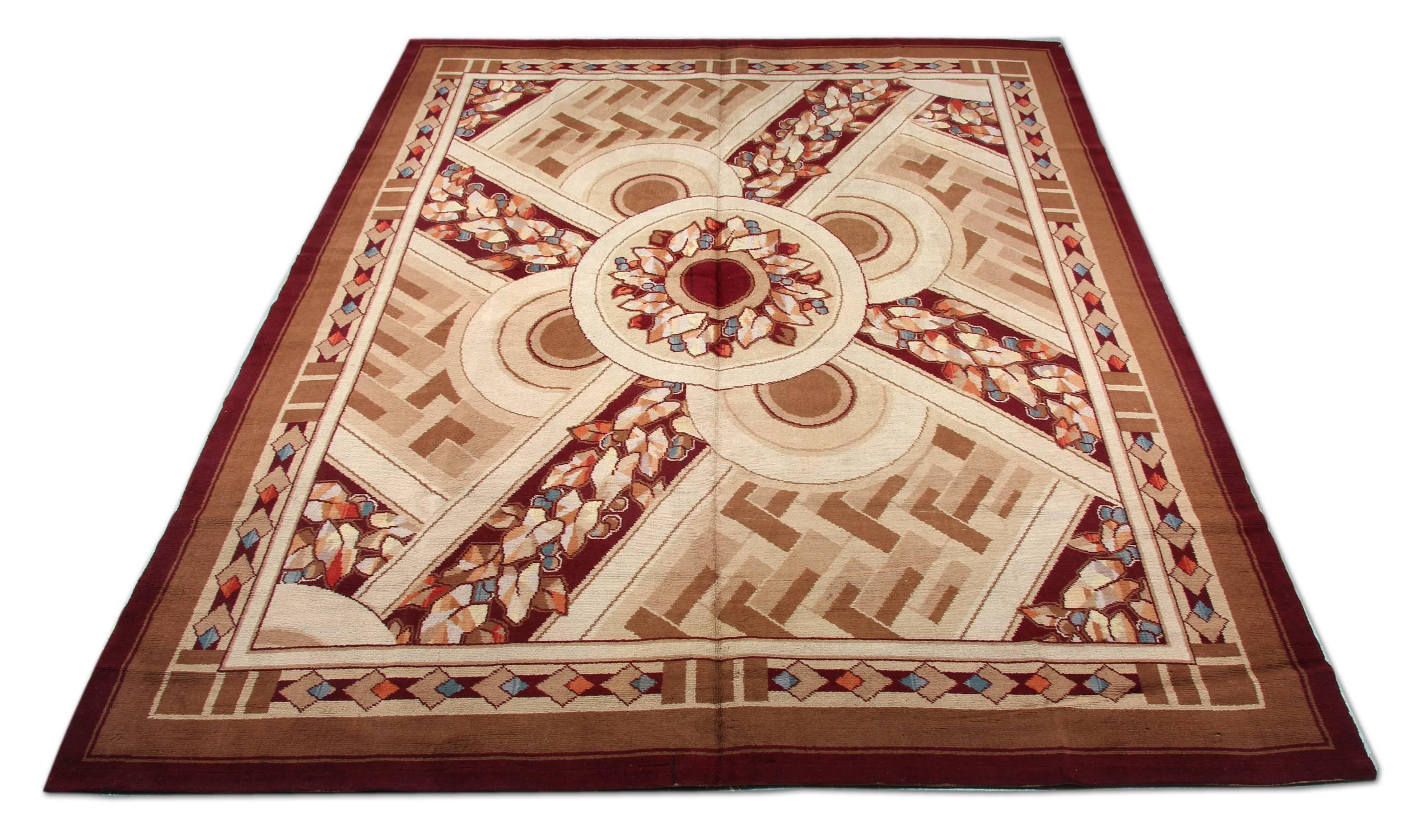 An excellent example of handmade carpet Art and Craft wool rugs. This golden brown rug has different sand colours and floral rug design. This geometric rug also has a deep brown border and matching floral shapes. These extra-large oriental rugs look