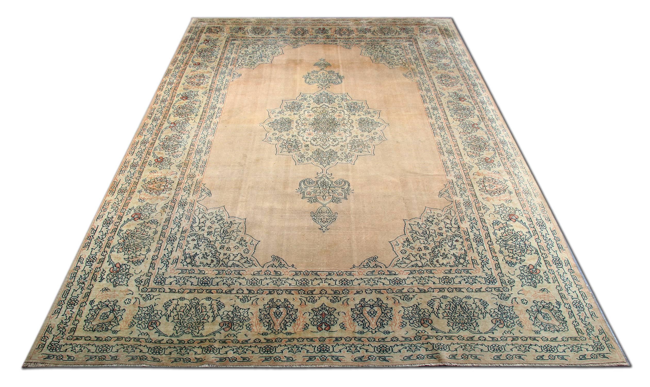 This Turkish Borlou woven rug is a decorative floral rug ideal for clients who are searching for muted colors and all over design. This is an example of a carpet rug from 1880s and is in excellent condition. These wool rugs would complement your