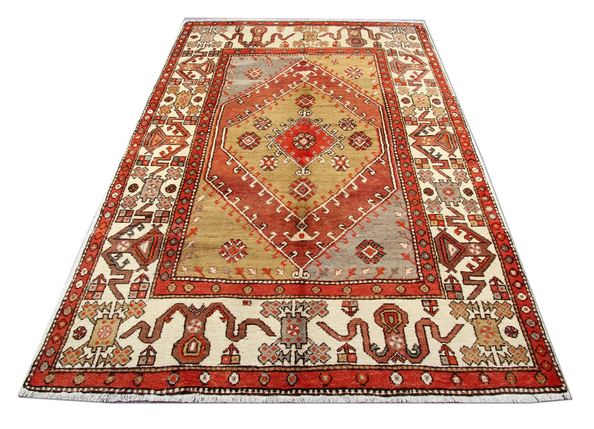 This hand Knotted soft colour vintage rug Milas handmade carpet rests beautifully upon a field of soft lime green, light grey and brown colours for the home decor. A medallion of multi colours and neutrals takes centre stage and is well balanced by