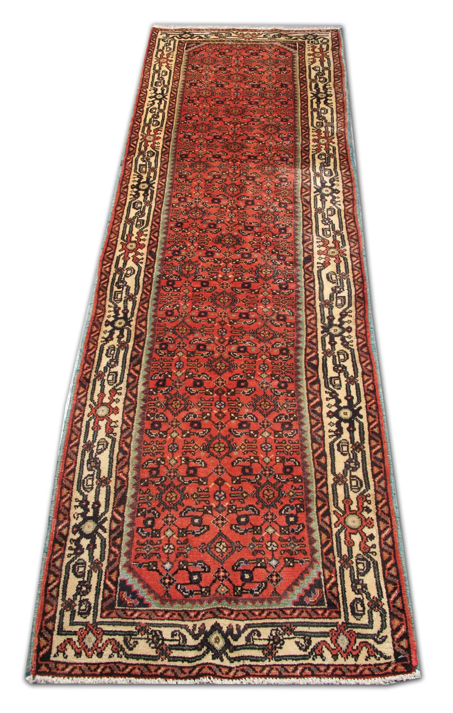 Earlier rugs and runners woven for the Persian market were traditionally long and narrow in accordance with local architectural norms. Such carpet weavings would have been utilized for affluent homes or for public reception halls. This colorful and