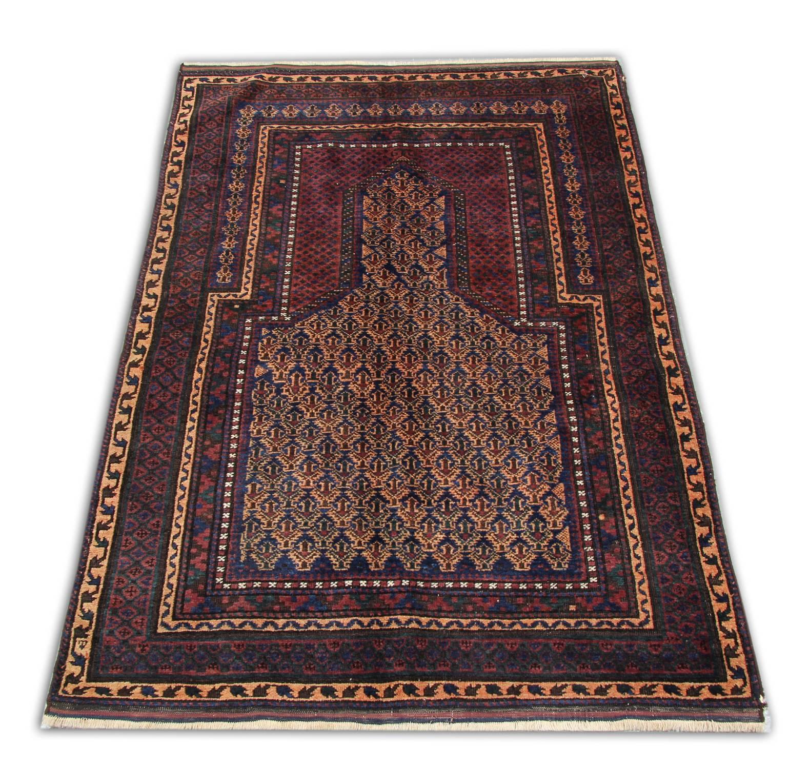 Hand-knotted in Balochistan, South West of Persia. Mehrab design, circa the 1930s - mint condition for its age and highly prized by collectors. Colours are rust, navy, black, sand with cream accents.