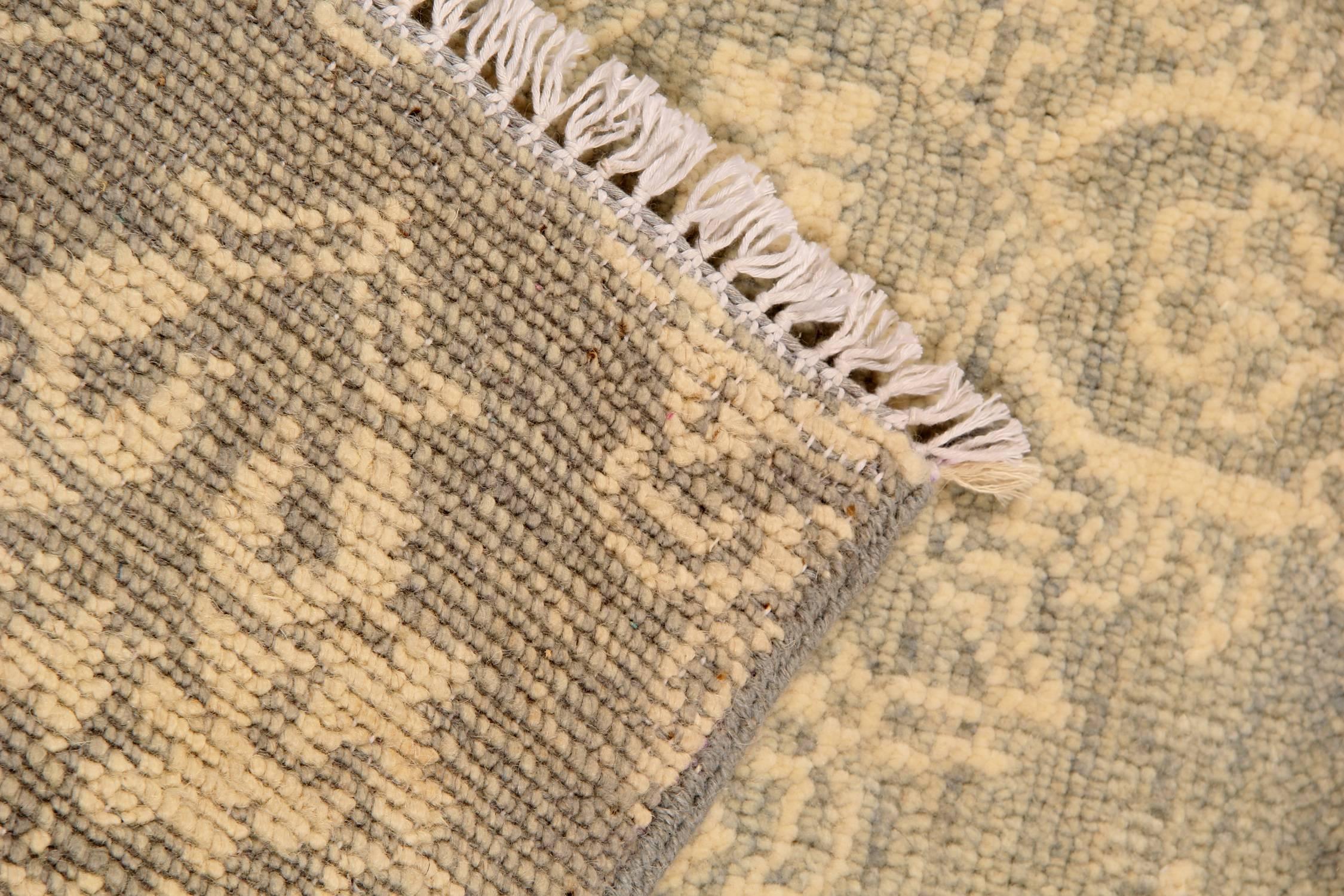 These handwoven carpet transitional Oriental rugs have an inherently sophisticated quality, from adding texture to monochromatic interiors to keeping the overall design scheme controlled instead of wild. A transitional khaki- gold rug like this one