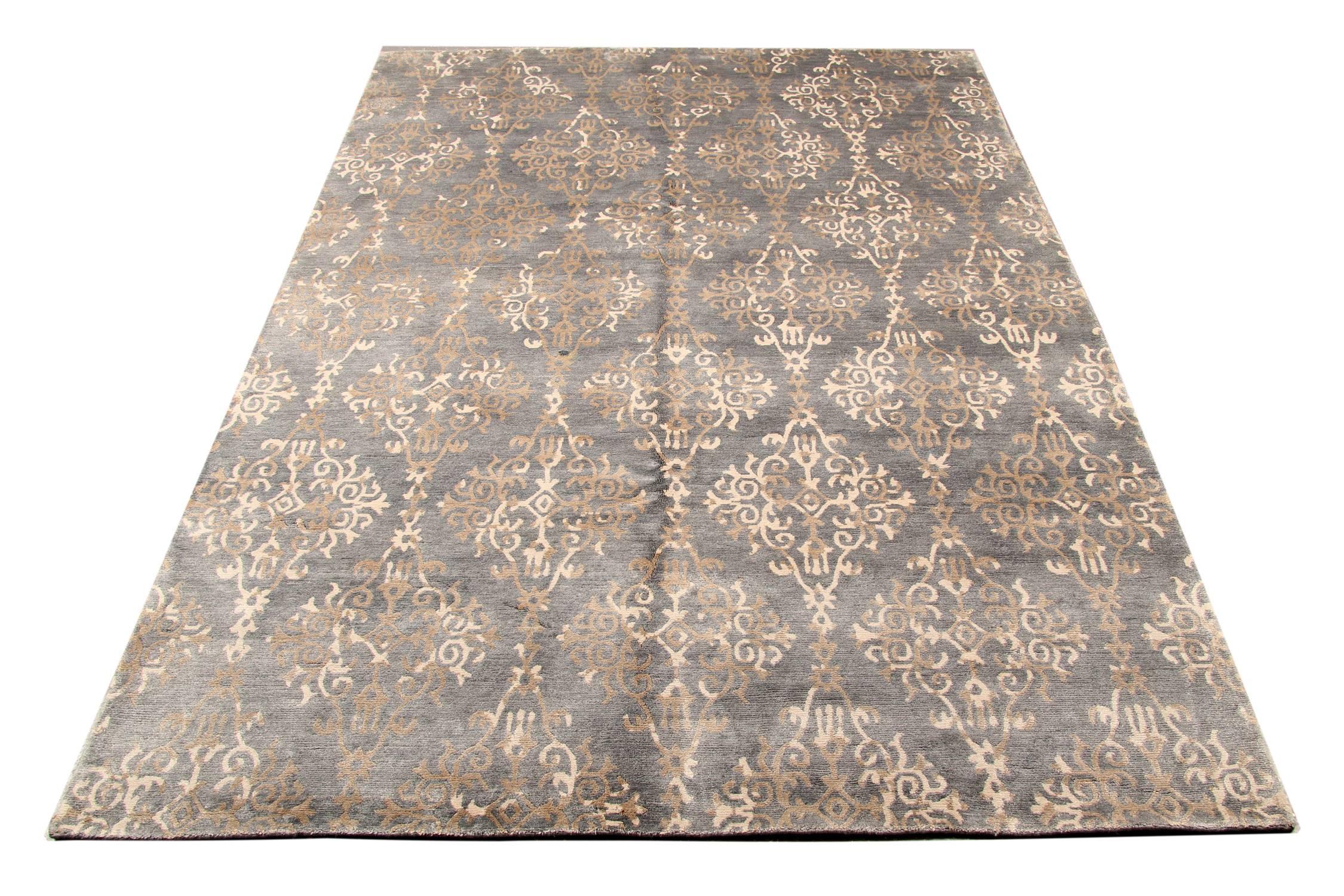 This transitional rug has an inherently sophisticated quality, from adding texture to monochromatic interiors to keeping the overall design scheme controlled instead of wild. A transitional grey field rug like this one has the power to connect