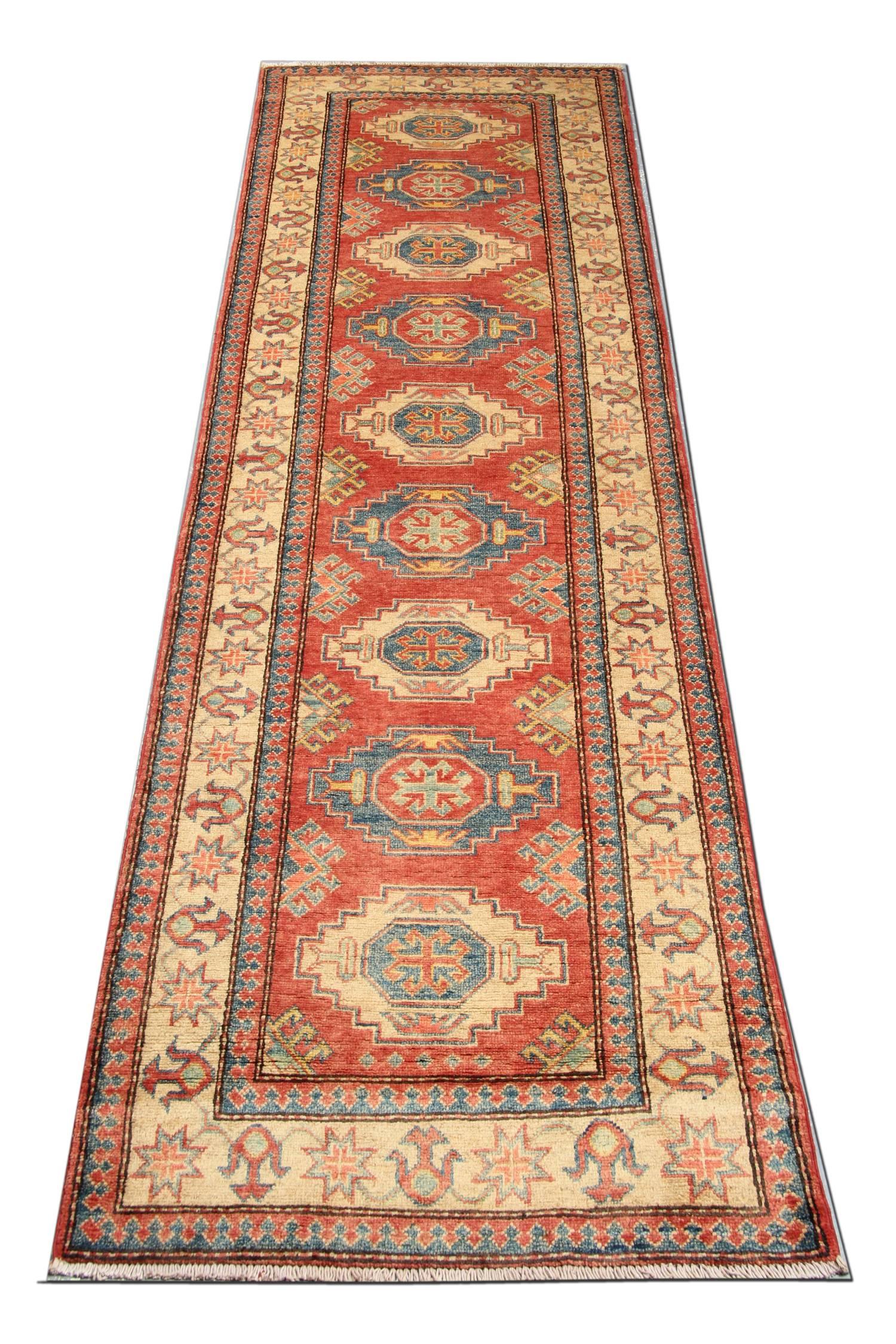 This is an example of a new traditional handwoven tribal rug. The geometric rug comes in a striking color combination. On this red rug we can see bright red, navy, light blue, sea blue, cream and caramel. The elegant creamy border of this woven rug