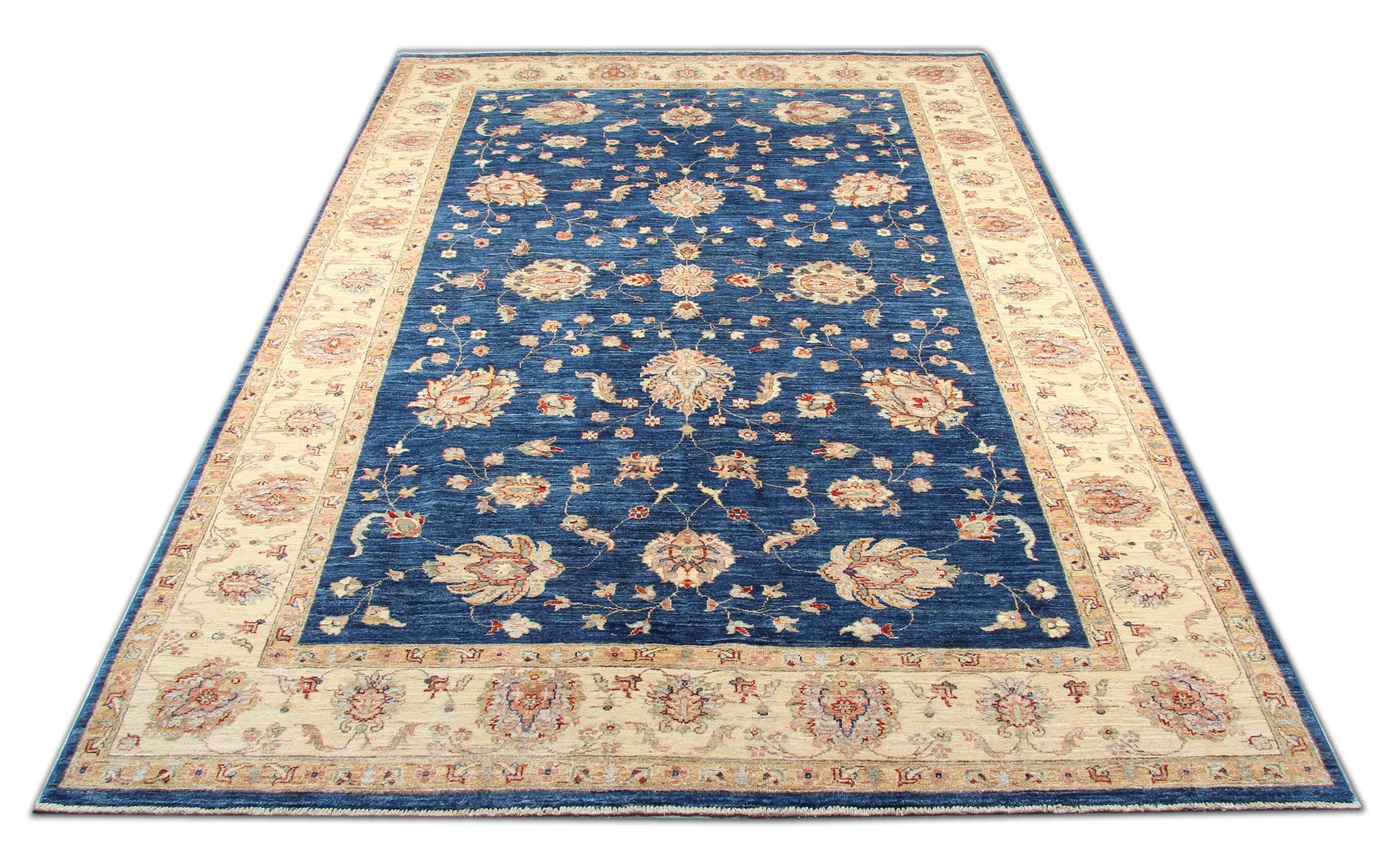 This magnificent golden blue rug is a Ziegler Sultanabad woven rug made on our looms by our master weavers in Afghanistan. The carpet rug is handmade with all natural veg dyes and all hand spun wool. The large-scale floral rug design makes