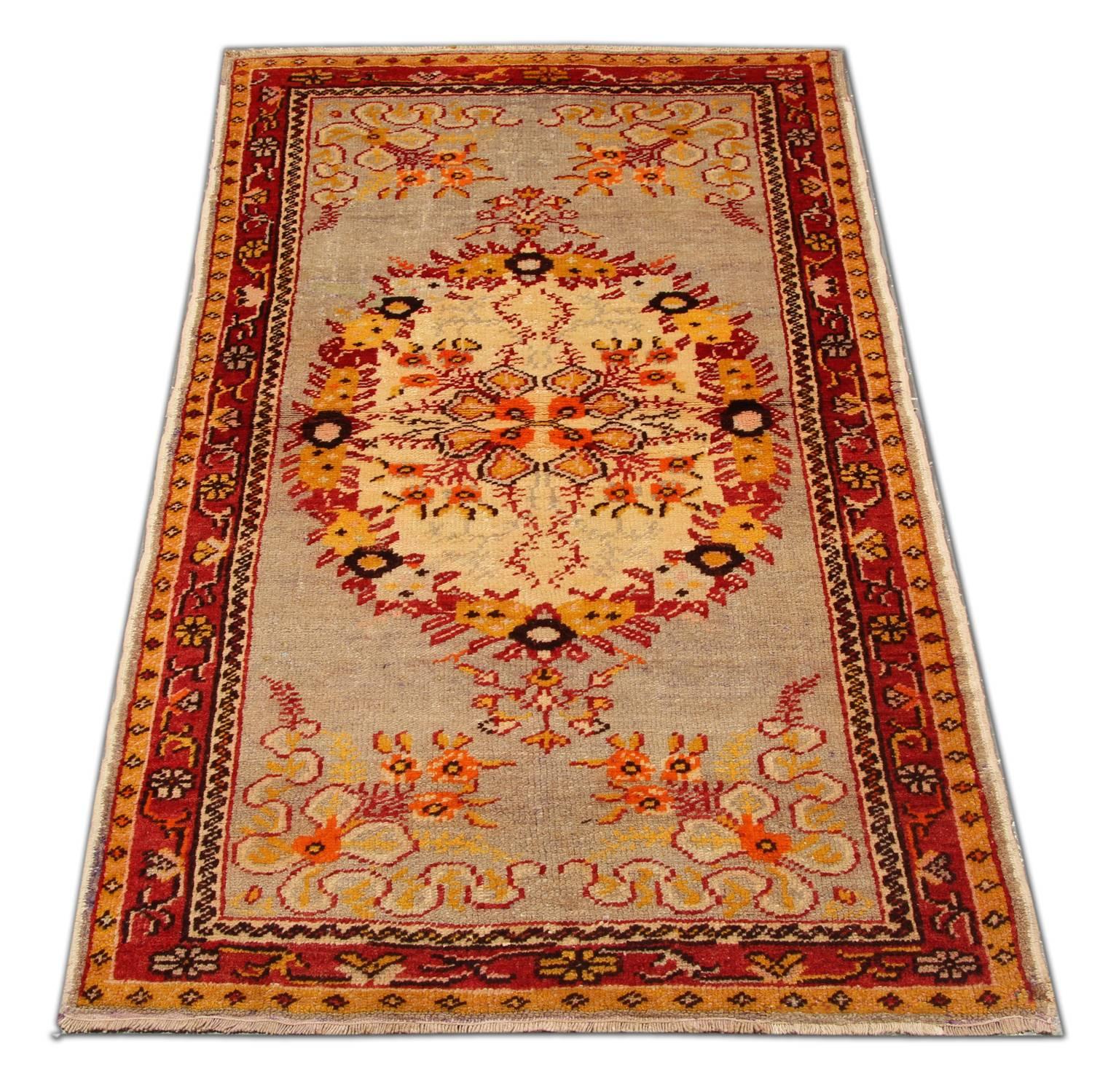 This gold rug is a kind of beautiful hand-knotted Turkish carpets or Anatolian rugs with geometric rug pattern and very elegant tribal and floral rug design. These wool rugs have vibrant natural dyes. The combination of rust red, orange, and gold in