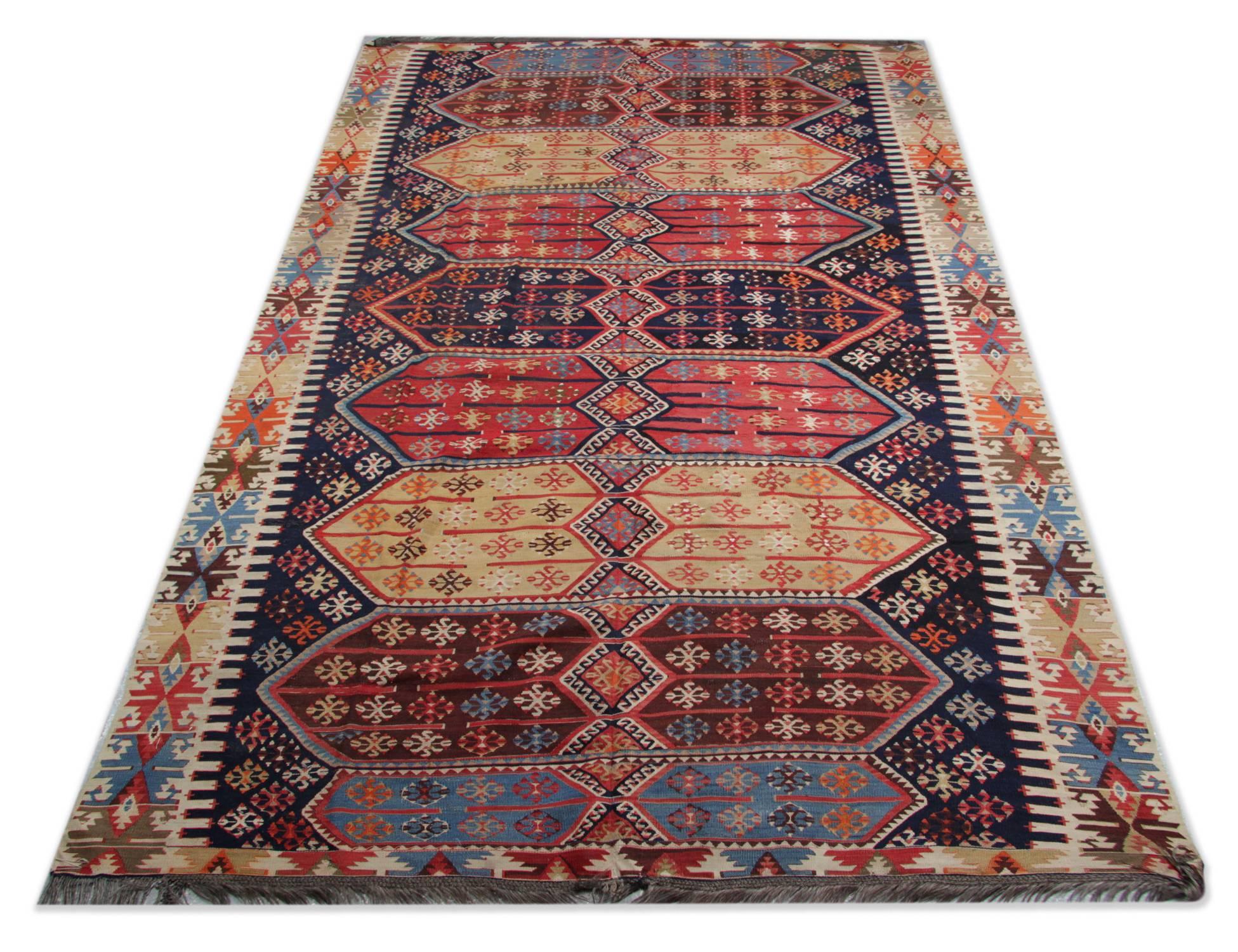 These oriental rugs are from Konya, which is located in the heart of Turkey. The workshop kilim rugs of Konya are mostly known for their distinctive geometric designs. These patterned rugs have all over geometric design with the same patterns on the