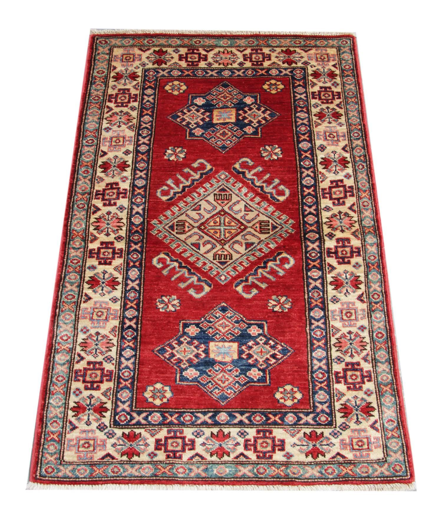 This new traditional hand-woven rug is featuring designs from the Kazak region. Traditional rugs are making the region of the Northern Persia. This floral rug has been made by Afghan weavers of top quality wool and cotton.  All over this tribal rug,