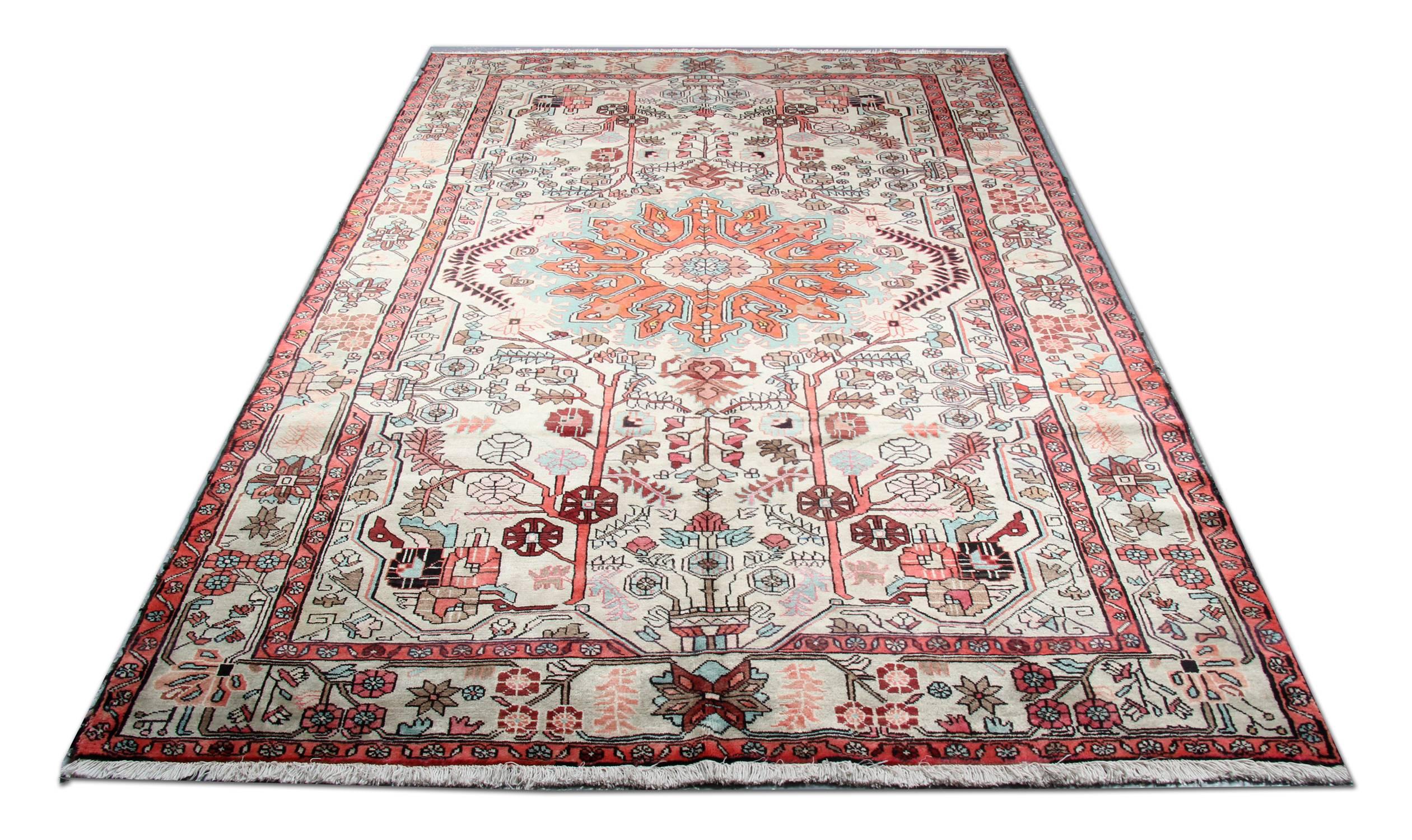 Handmade Oriental wool area rug, Traditional Afghan carpet rug- 200x300cm 
This fine oriental rug was handwoven in Turkey in the 1990s with the finest organic materials. The central design has been woven on an ivory background with blue, orange,