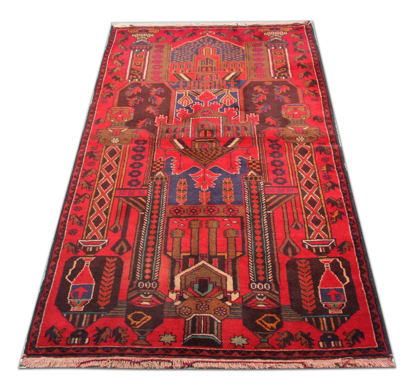 This beautiful wool rug features a top to bottom design with an array of tribal medallions and motifs. Blue and red are the main colours woven in this rug, contrasting beautifully to create this centrepiece rug. This rug would make a perfect