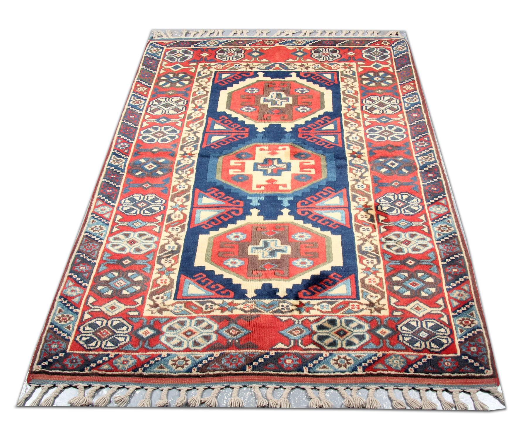 This beautiful geometric rug has been woven with a fantastic design and colour combination. Featuring colours of blue, red, ivory and green are woven beautifully to create this eye-catching rug. This rug would make a perfect addition to any home.