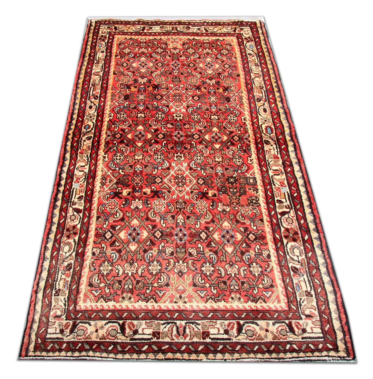 This harmonious wool rug has been woven with a fantastic all-over design. Featuring a highly-decorative repeat pattern central design woven in colors of orange, rust and brown accent colors. This rug would make a perfect addition to any home.