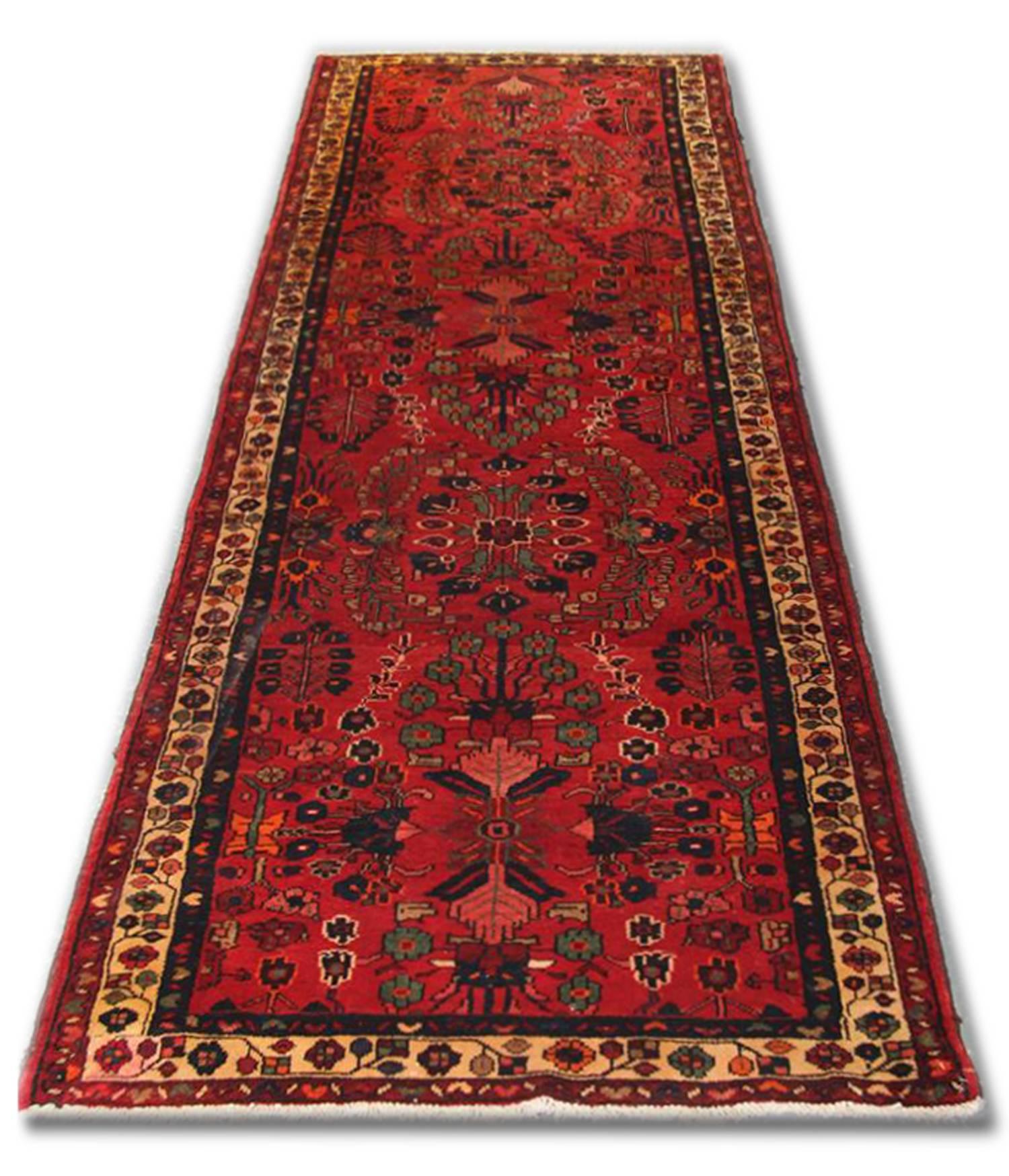 This fine wool rug was woven by hand in the 1940s and features a rich red background and elegant repeat pattern design.
Constructed with the finest organic materials including hand-spun wool which has been intricately hand knotted to create an