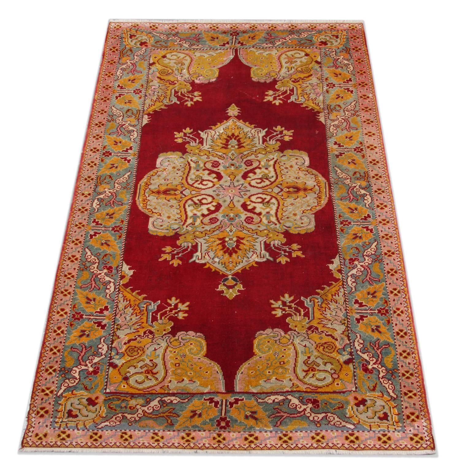 This red rug is a kind of beautiful hand-knotted Turkish carpets or Anatolian rugs with geometric rug pattern and very elegant tribal and floral rug design. These wool rugs have vibrant natural dyes. The combination of rust red, orange, and gold in