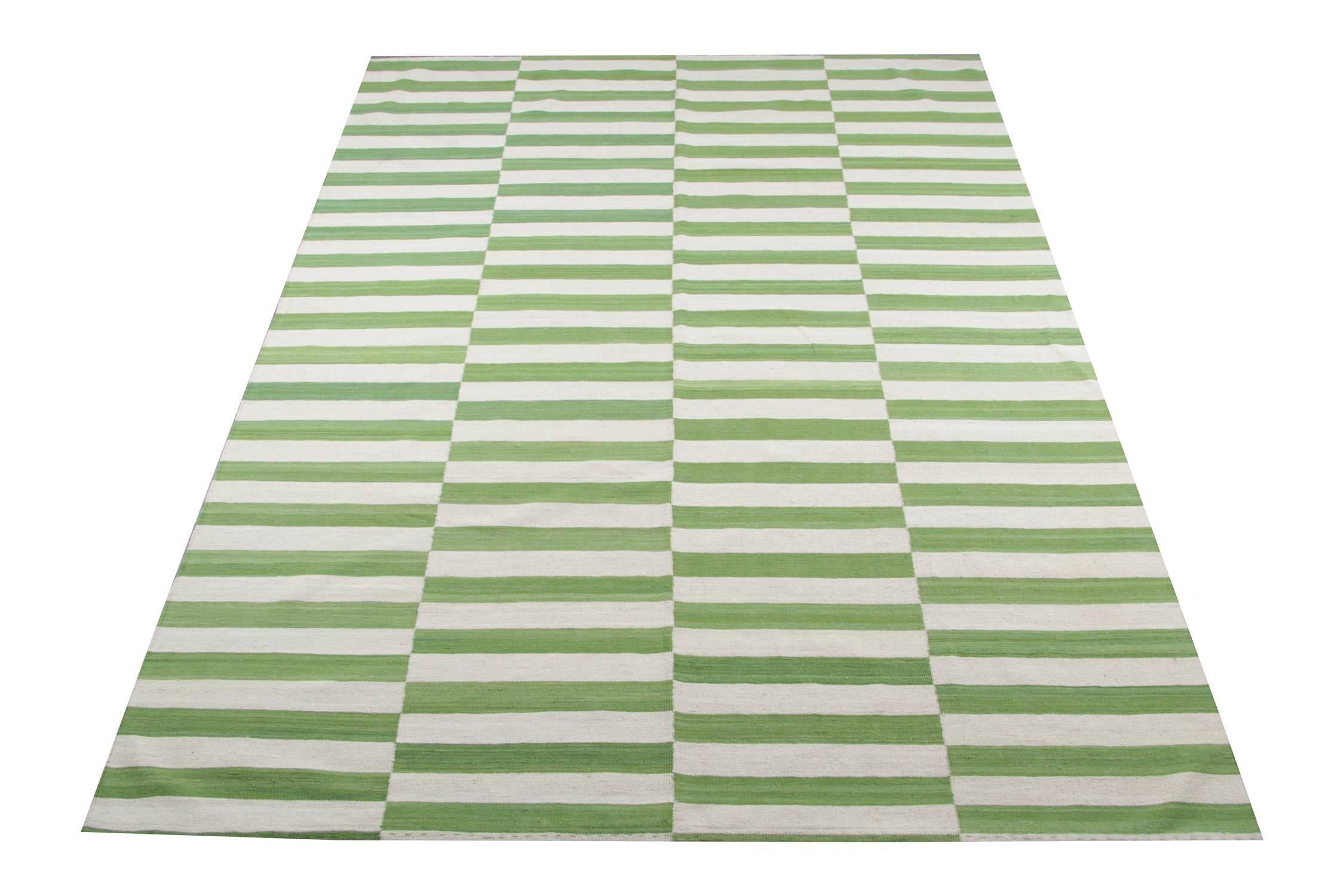 This striped rug is 100% handmade in Afghanistan. Kilim rugs are flat woven and the materials used for these luxury rugs are wool and cotton.  Only organic dyes were used for these handmade rugs. This green rug is hard-wearing and therefore will