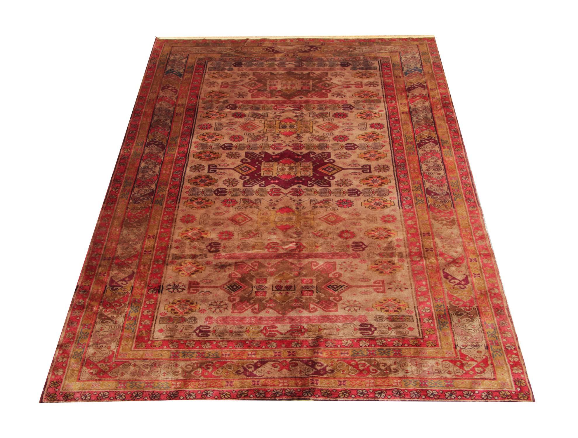 This is an antique Caucasian tribal rug from Karabagh.  It is a geometric rug with an excellent colour combination and the contrasting gold, purple and rust colours, look unique on this carpet. These antique rugs are back from the 1890s and could