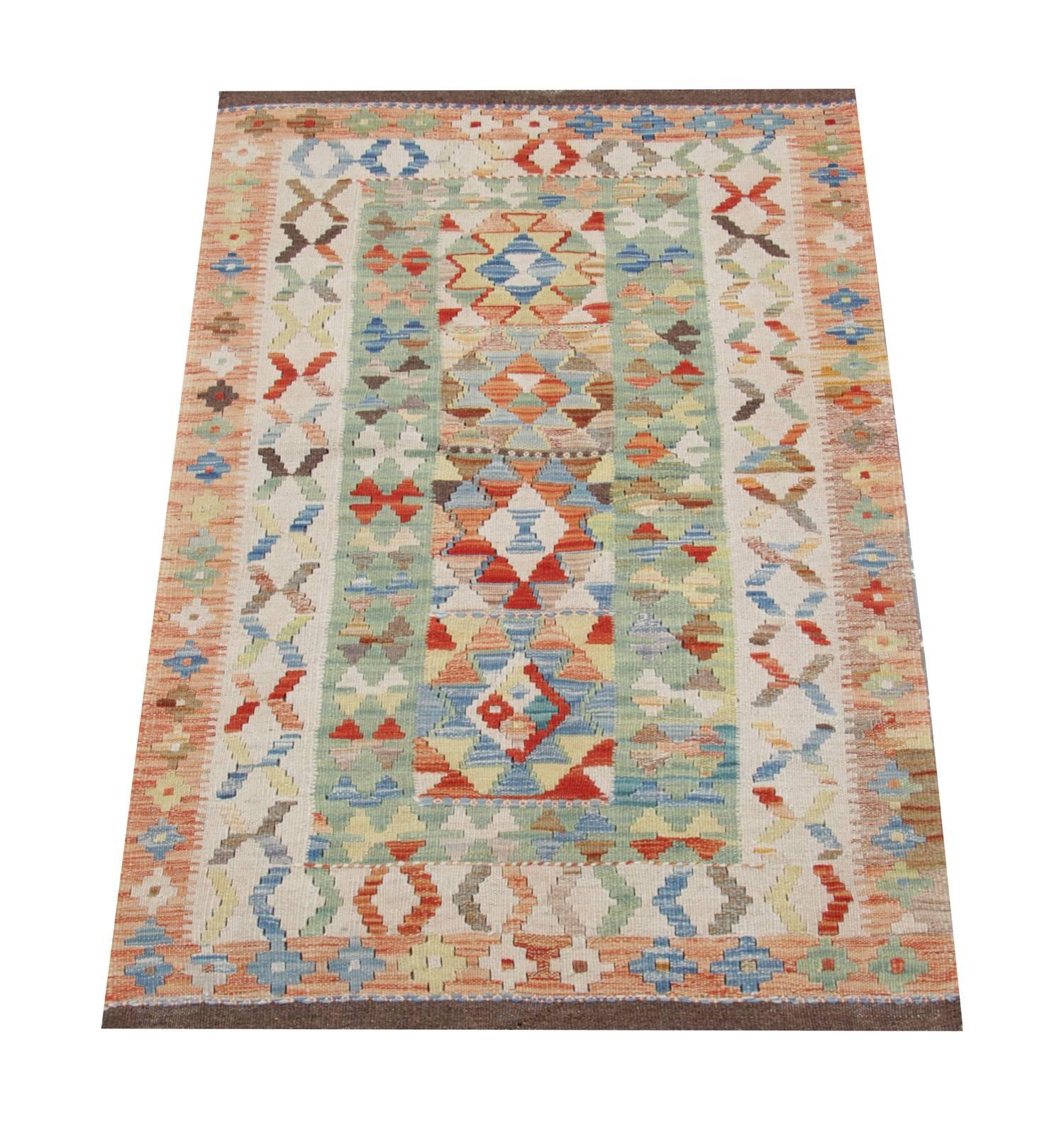 This geometric rug is handmade in the North of Afghanistan by Uzbek and Turkmen tribes. The materials used for this flat weave rug are wool and cotton. For the production of these luxury rugs have been used only organic dyes too. This geometric rug