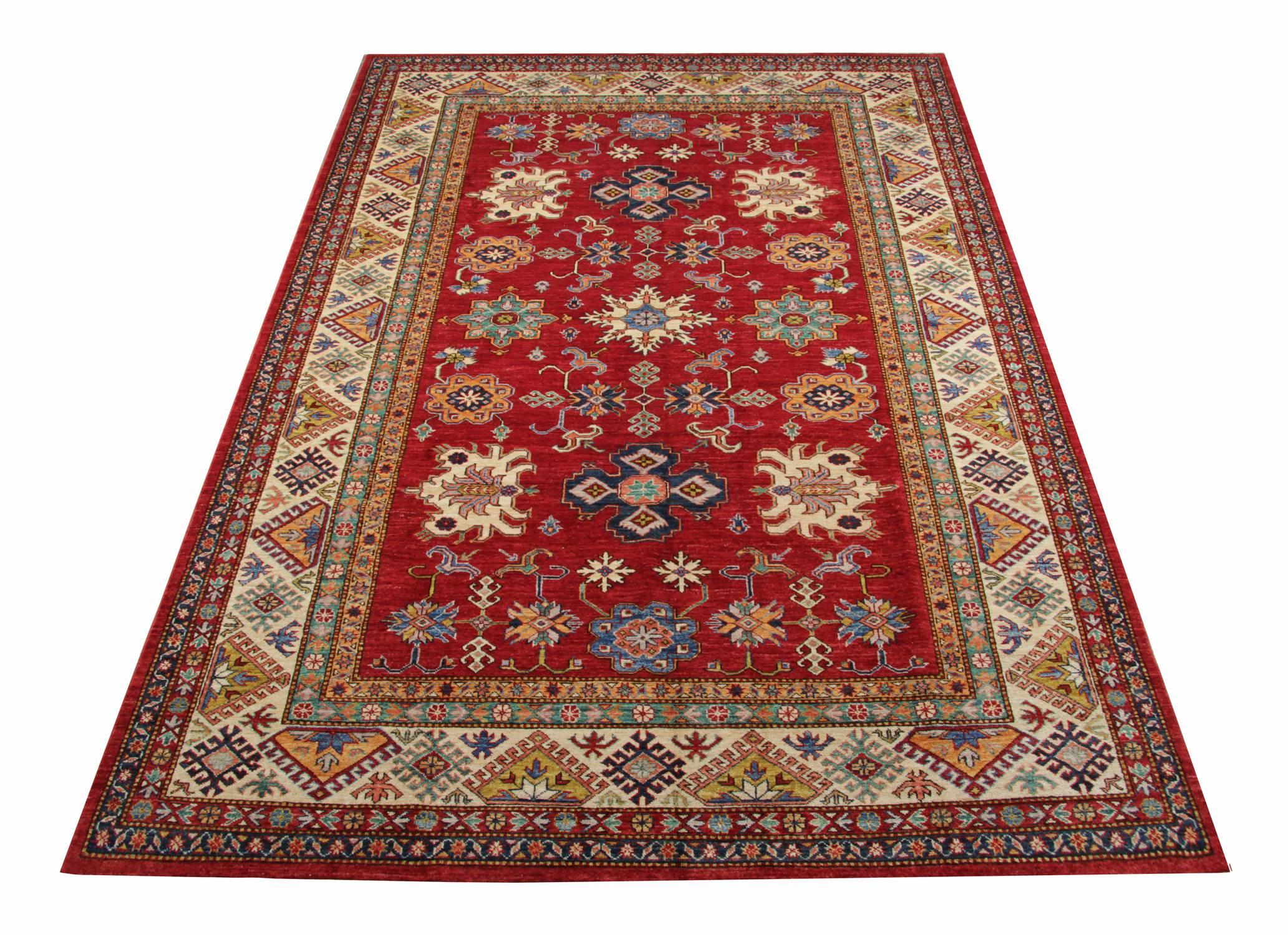 Handmade carpet Kazak rugs are patterned oriental rugs and primarily produced as village productions rather than city pieces. This red rug made from organic materials particular to individual tribal provinces and the rugs of the Caucasus normally