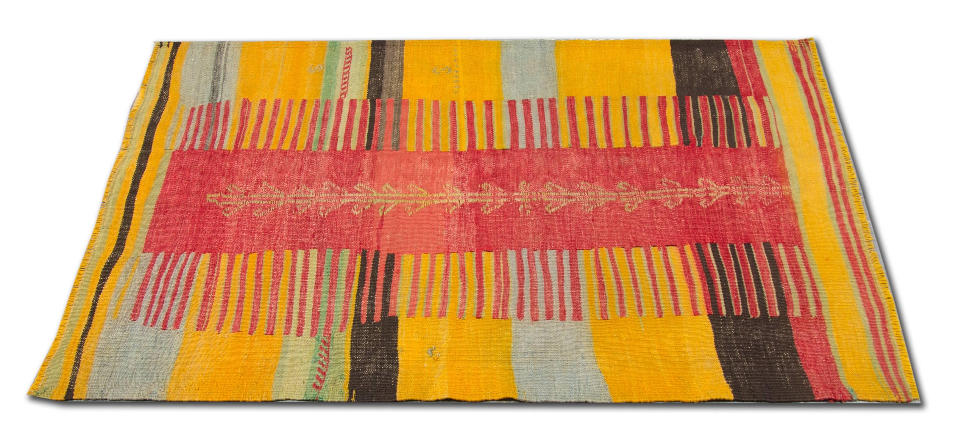 These are antique wool rugs from Aydin, located in the western Anatolia. This geometric rug has distinctive colorful designs. This striped rug has different size stripped patterns in yellow, soft blue, raspberry red and dark brown colors. These