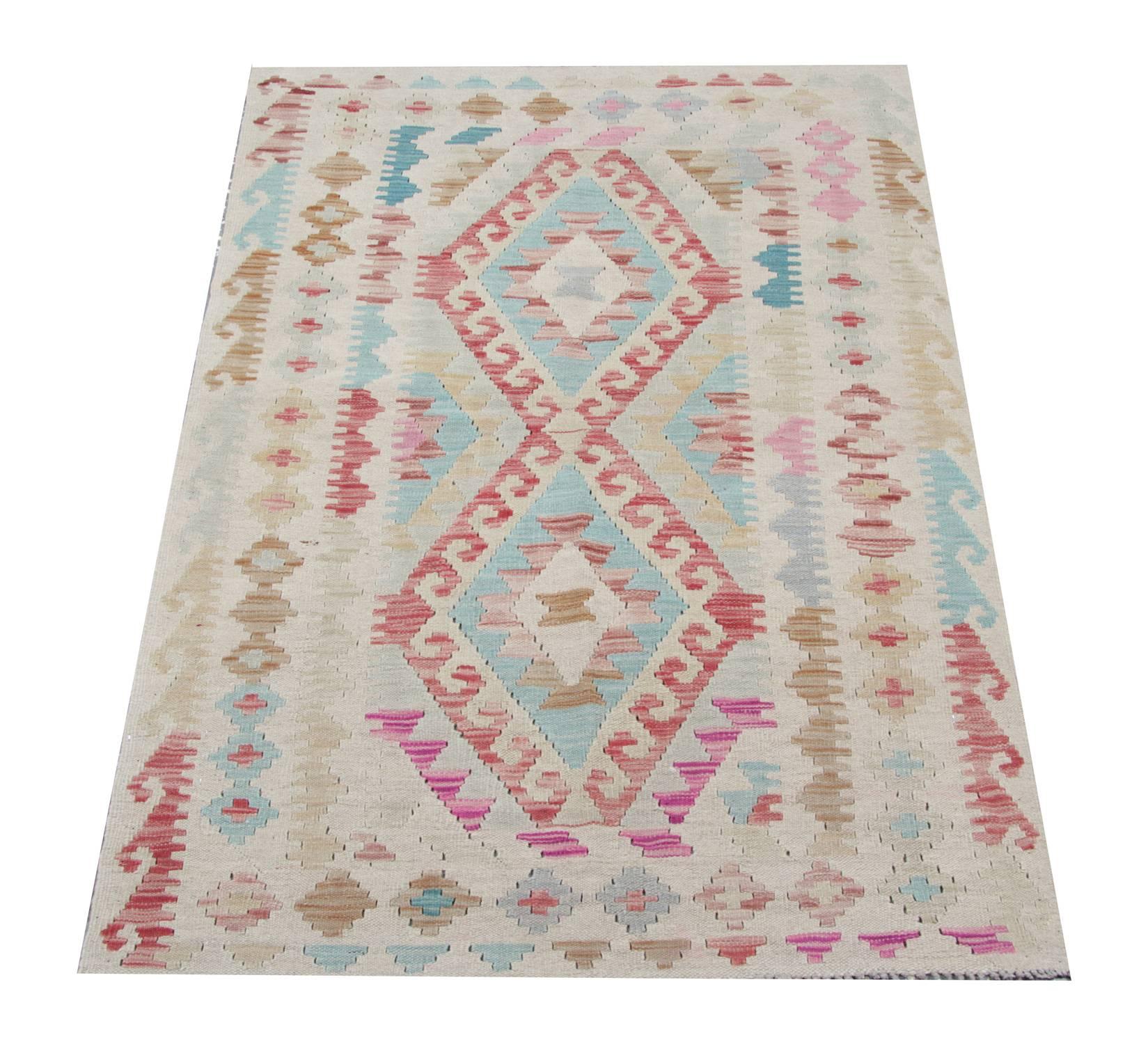 This geometric rug is from the family of Kilim rugs in the North of Afghanistan by Uzbek and Turkmen tribes. The materials used for the production of these handmade rugs are wool and cotton. Only organic dyes have been used for these colorful rugs.