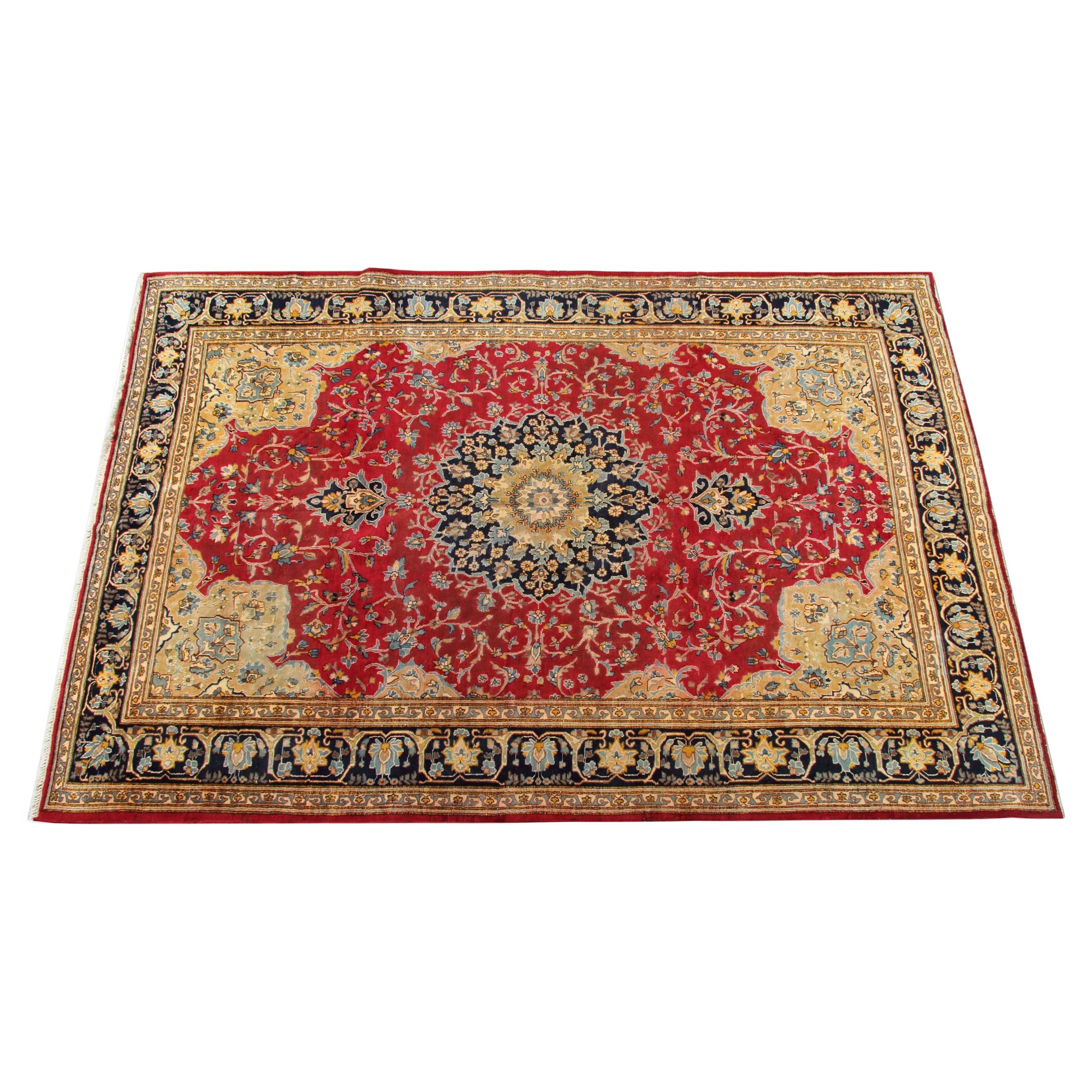 Decorated with a unique colour pallet of gold, red and deep blue this fantastic wool rug is sure to uplift any room its introduced to. Featuring a detailed central medallion with a highly-detailed floral surround design and border. The colour and