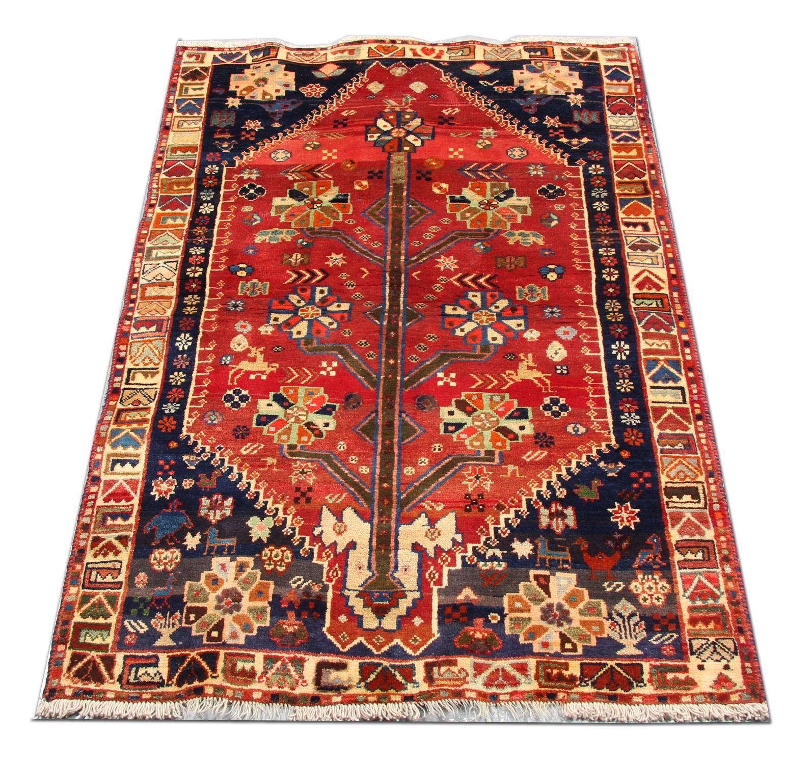 This beautiful rug features an all-over design. Woven with a great level of detail and a fantastic colour pallet. The central design features a tree with floral emblems and motifs are woven throughout. This oriental rug design is then enclosed by