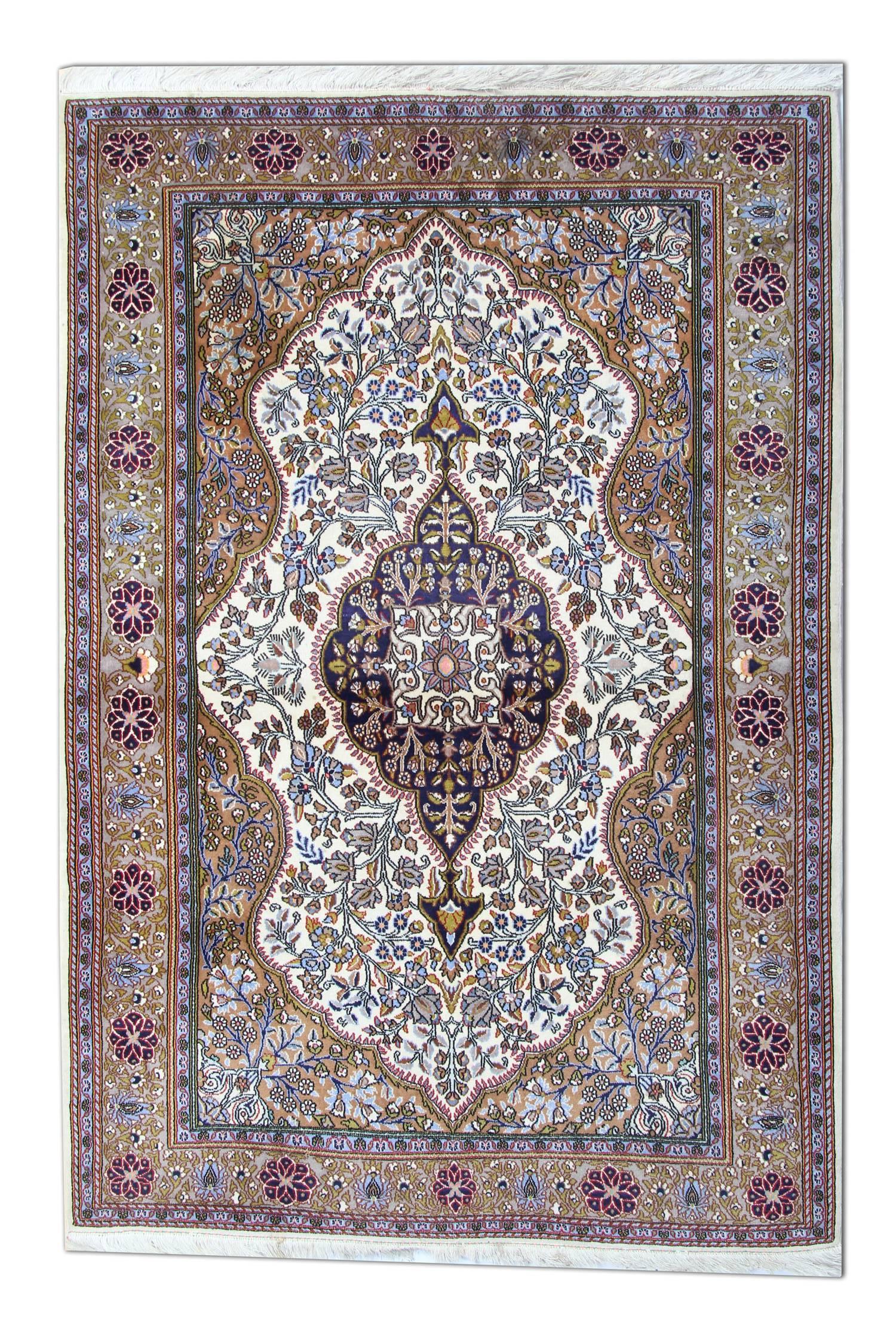 Easily style this marvellous wool rug in any room and create an instant accent piece. Woven by hand with a statement central medallion and highly detailed, floral surround design. The unique colour palette includes accents of mustard, brown, purple