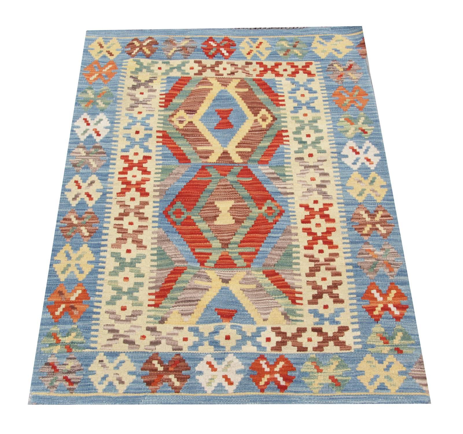 This flat weave rug has been handmade in the North of Afghanistan by Uzbek and Turkmen tribes by using local wool and cotton. The quality of the woven rug is enhanced by the use of organic dyes. The geometric rug shows a tribal rug design deriving