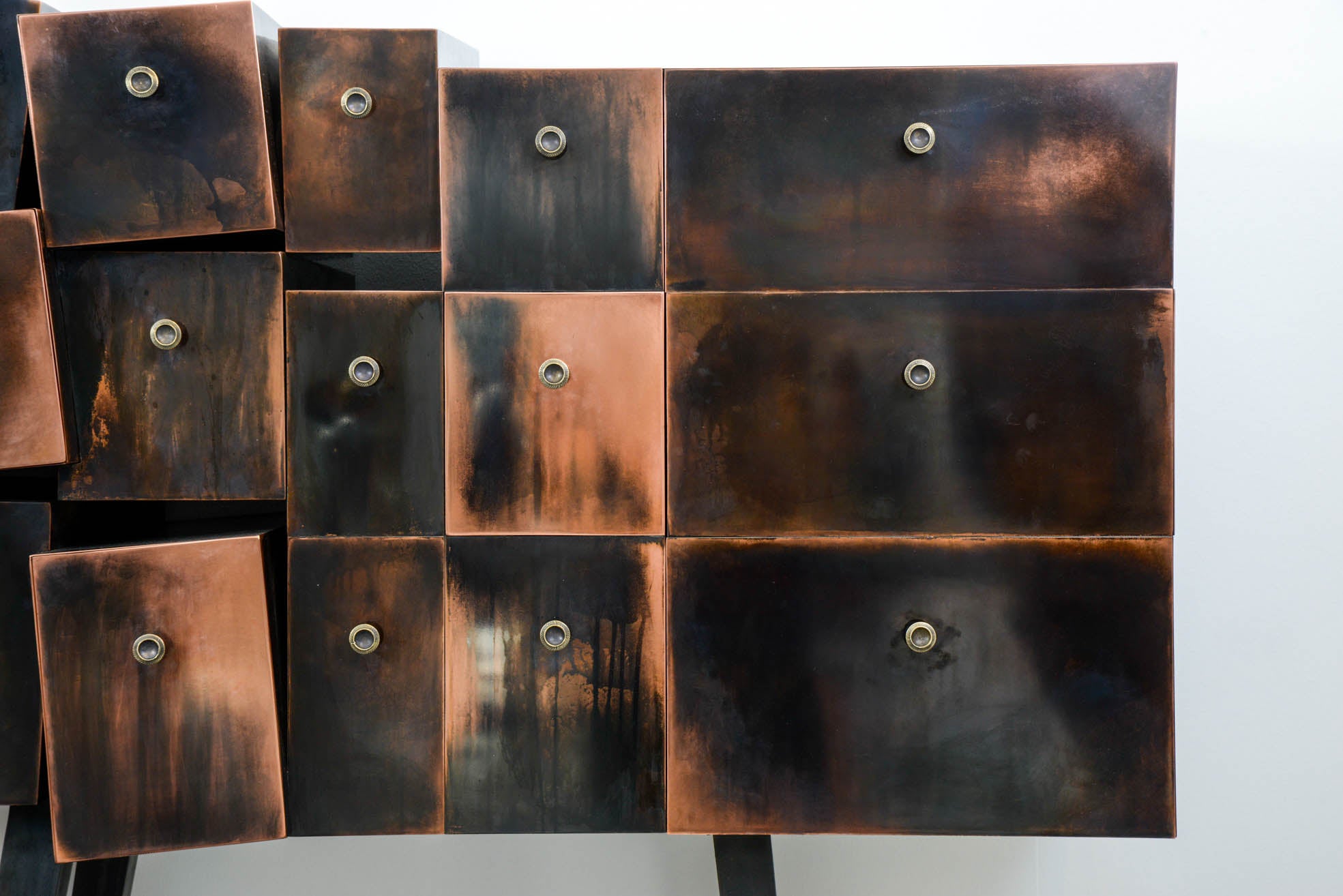 Deconstructed copper cabinet, one door, three front drawers, two side drawers, basement in metal
signed and dated by the artist Erwan Boulloud.