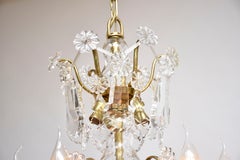 Rococo style gilt brass and crystal chandelier