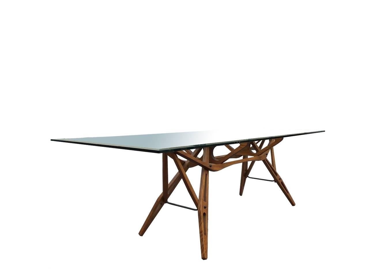 Reale table, design Carlo Mollino, Zanotta, 1990.
Designed in 1946, the Royal table consists of an elegant oak frame and the top is glass with bevelled edges.
 
Perfect for the dining room, but great as a desk, table Royal combines the elaborate