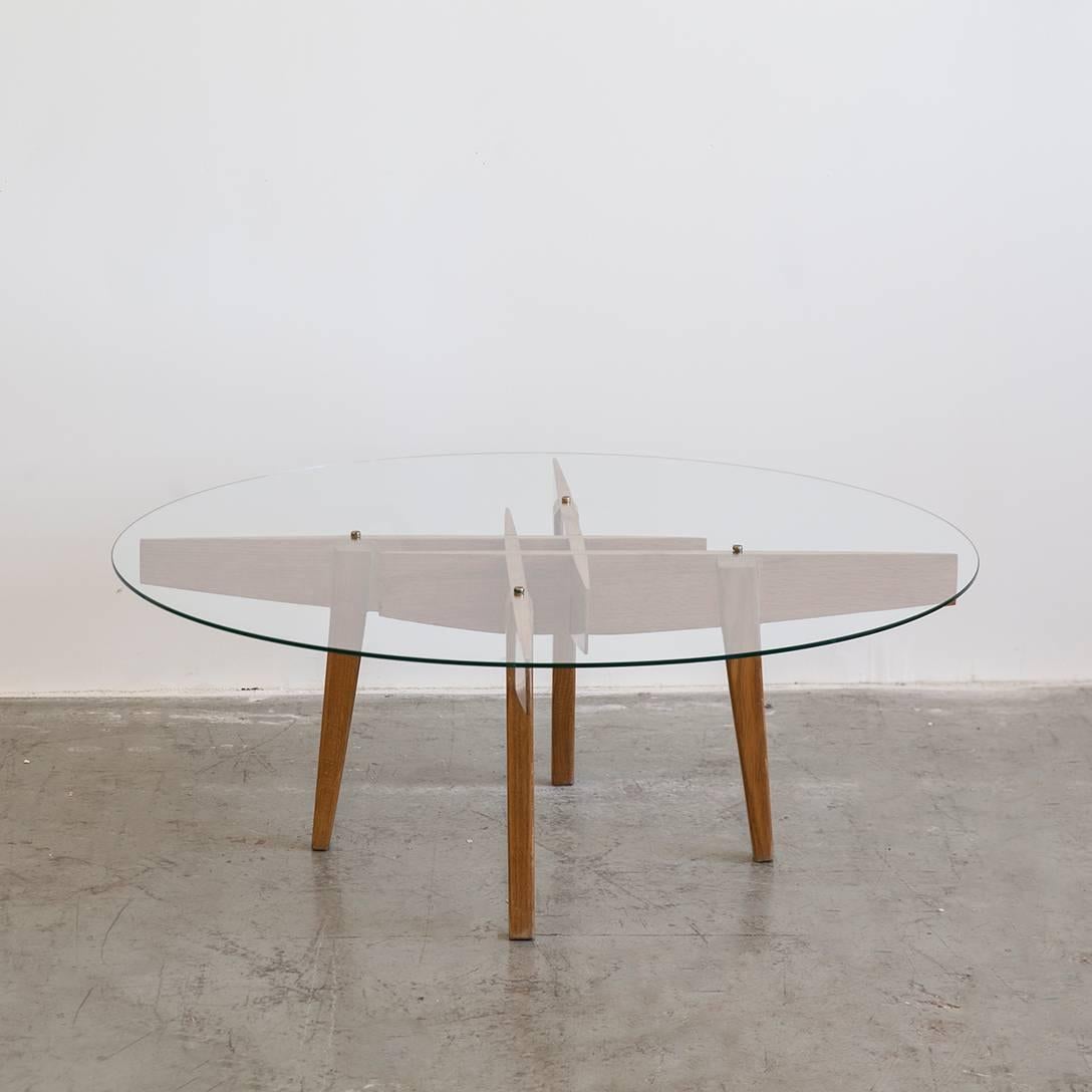 Coffee table by Gio Ponti, in oak with glass top and brass hardware, Italy, circa 1950s.