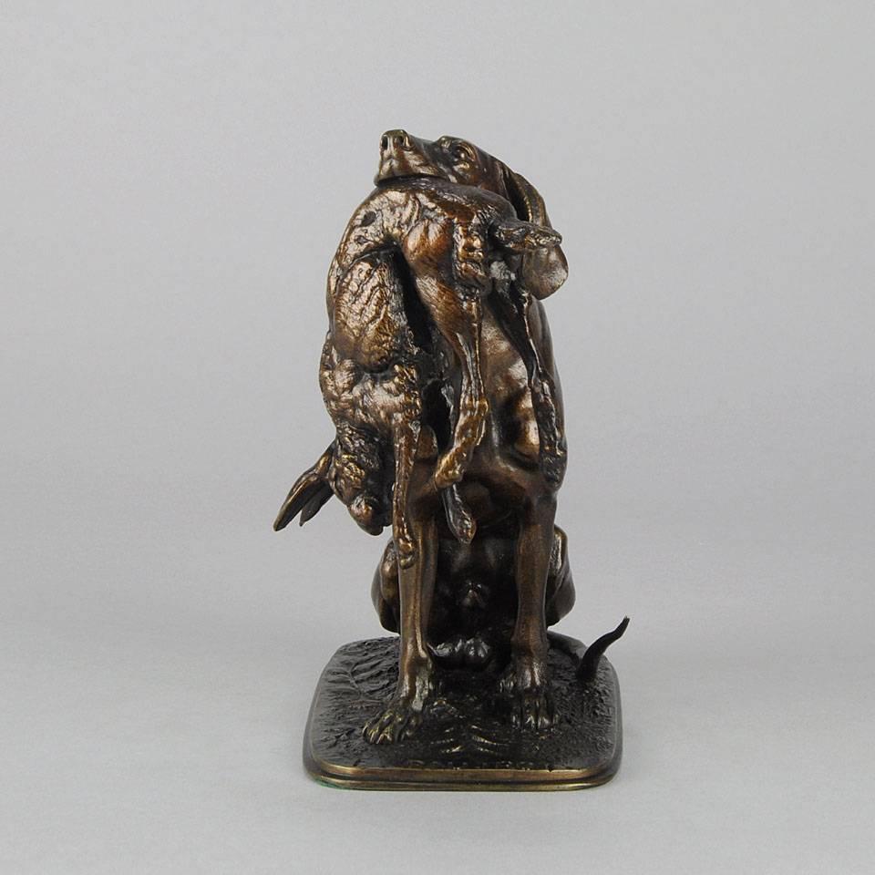 A wonderful bronze study of a seated pointer patiently holding a hare in its mouth. The bronze with very fine mid to golden brown patina and excellent hand chased surface details. Signed F Pautrot and inscribed with Salon inscription to the side
