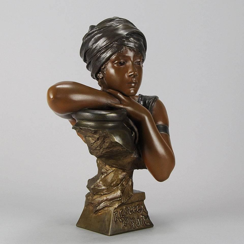 A charming late 19th Century bronze Art Nouveau bust  of a young girl resting her chin upon her arms as she leans on an urn, exhibiting excellent tri-coloured patina and very fine detail. Signed Villanis, stamped with a foundry seal and titled to