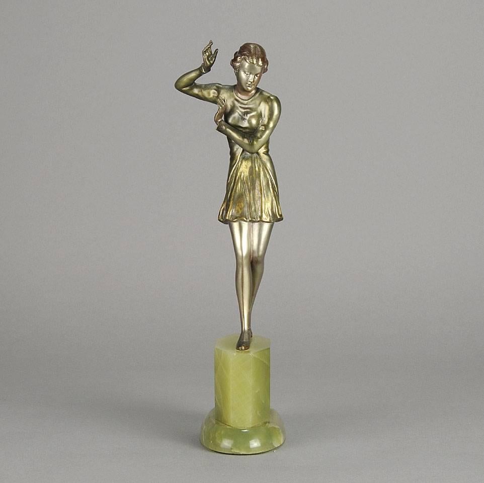 A very fine early 20th Century Austrian Art Deco cold painted bronze figure of a beautiful young lady in stylised pose, with excellent colour and detail, raised on an onyx base, signed under foot R Lor.