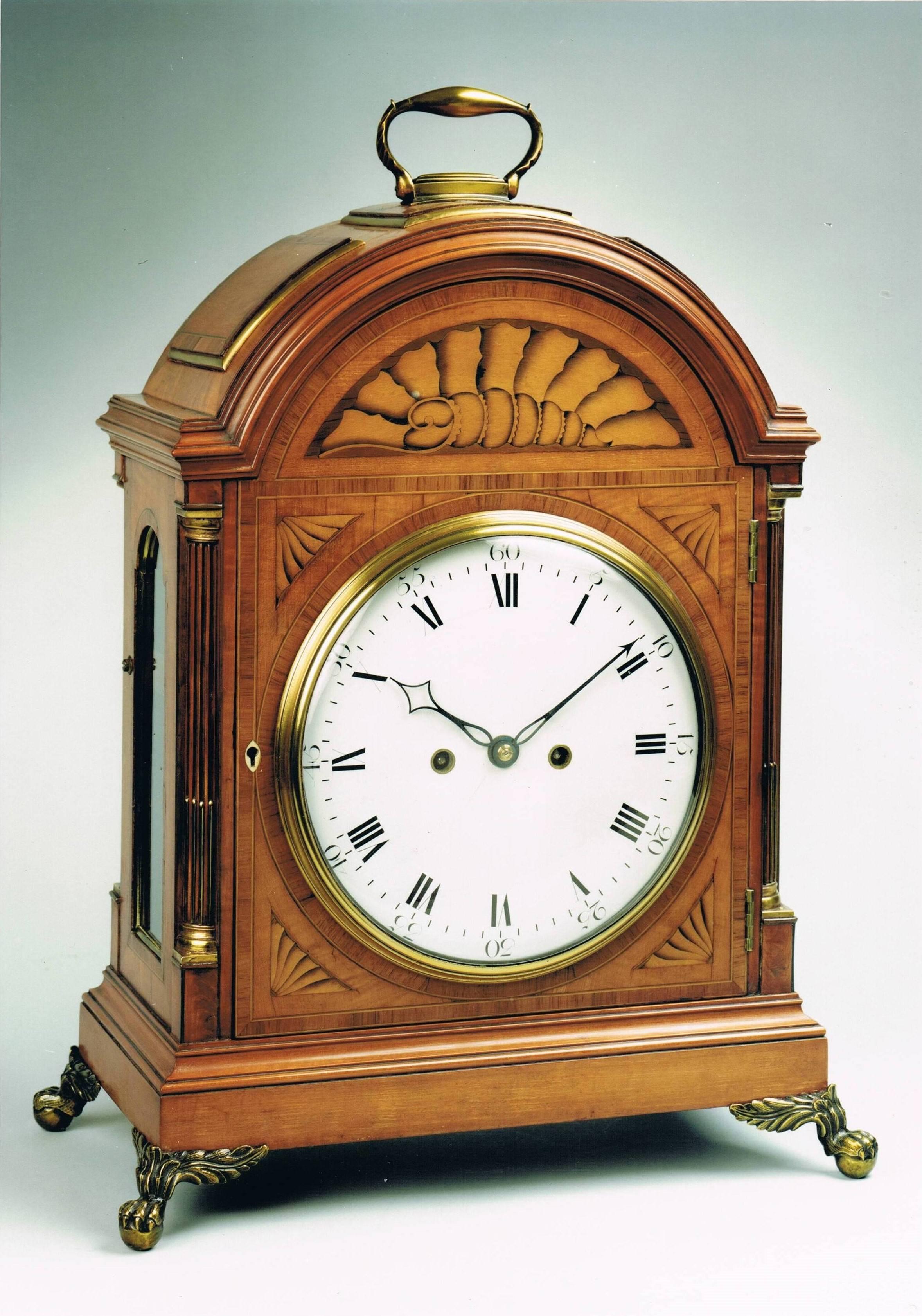 A fine and rare late 18th century George III period satinwood bracket clock of unusually large proportions, by Thomas Wright of Poultry in London, who was 'Watch-maker to the King.'

The arch top with a brass ring handle, with raised panels banded