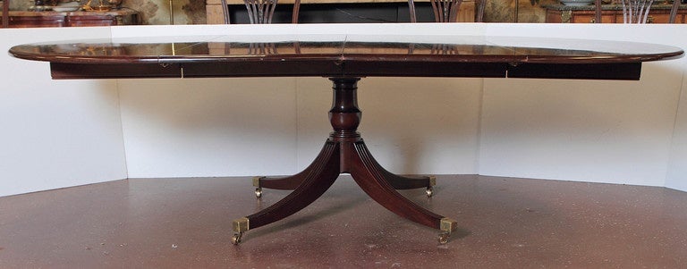 Sheraton style banded mahogany dining table by Smith & Watson