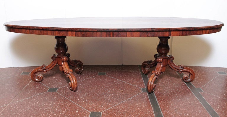 19th century Portuguese oval rosewood two-pedestal table.