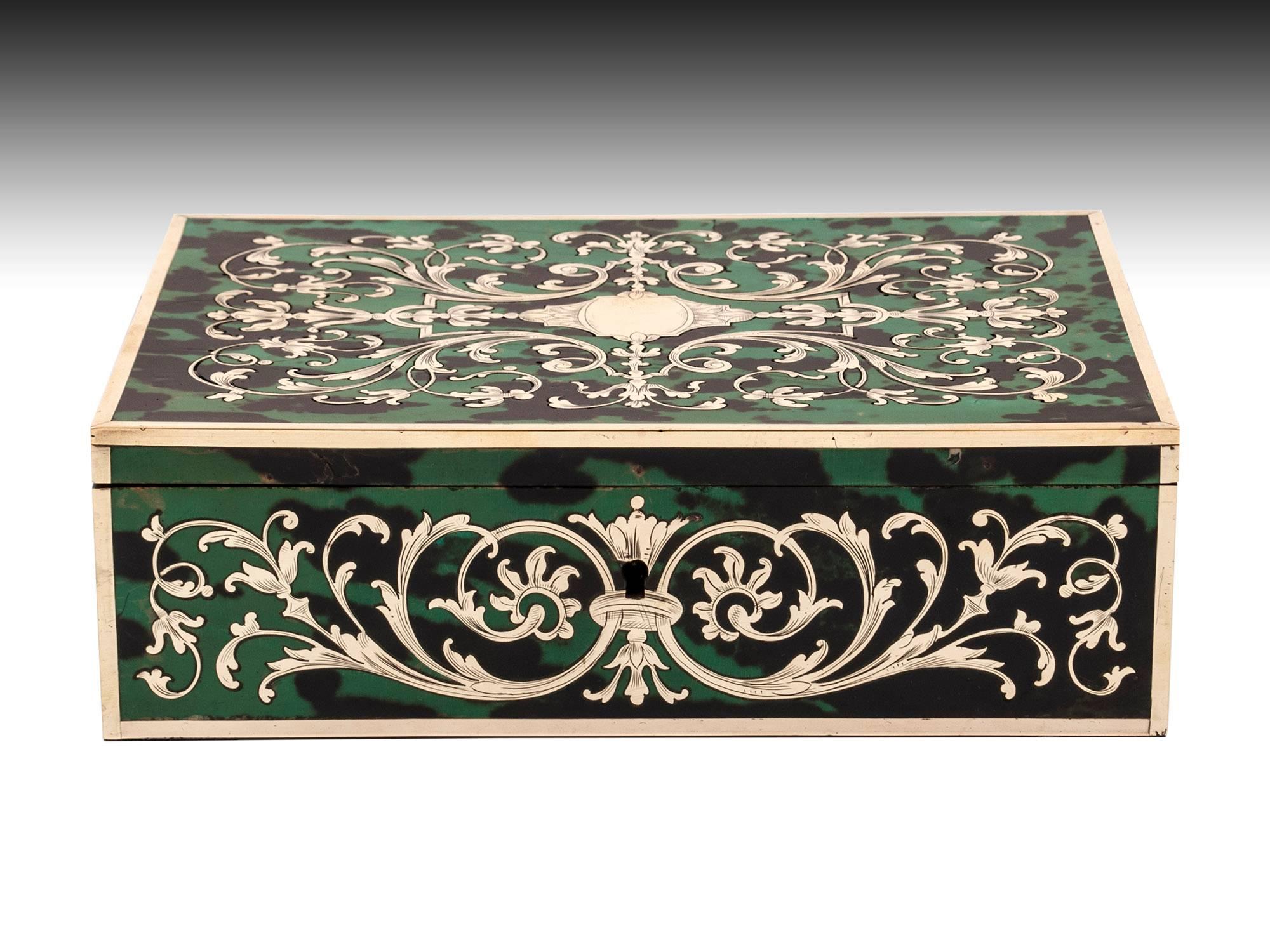 Antique Boulle jewelry Box, made of green stained tortoiseshell & engraved brass, both placed together in sheet form and hand cut into this beautiful tight mirrored design. 
The interior is lined in green silk paper and teal padded cotton velvet to