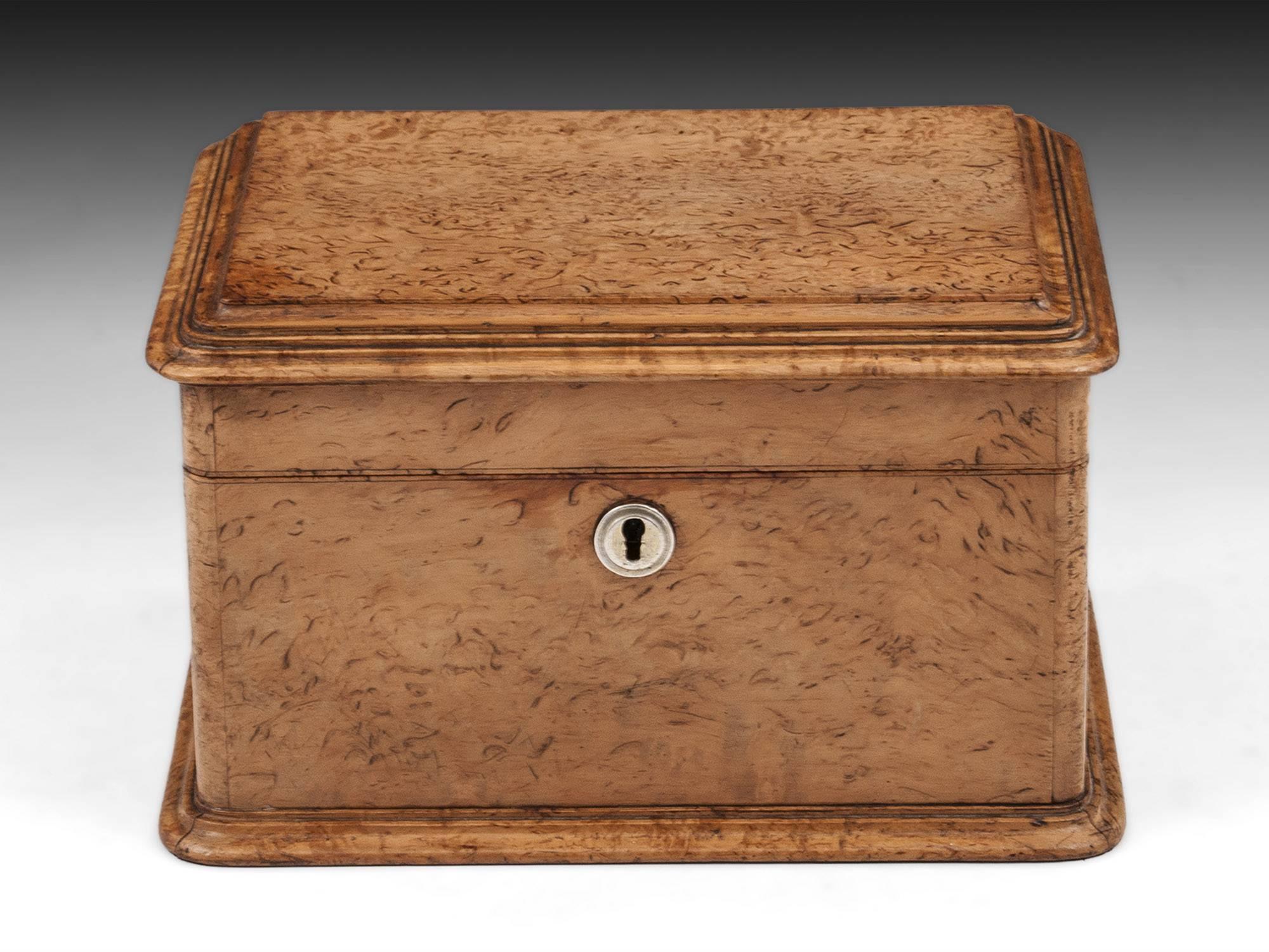 Antique solid Masur Birch jewelry box with a moulded edge lid and plinth. 

The interior of this elegant Masur Birch jewellery box features a removable silk lined tray, with padded compartments including two for rings, earrings or cufflinks. Lined