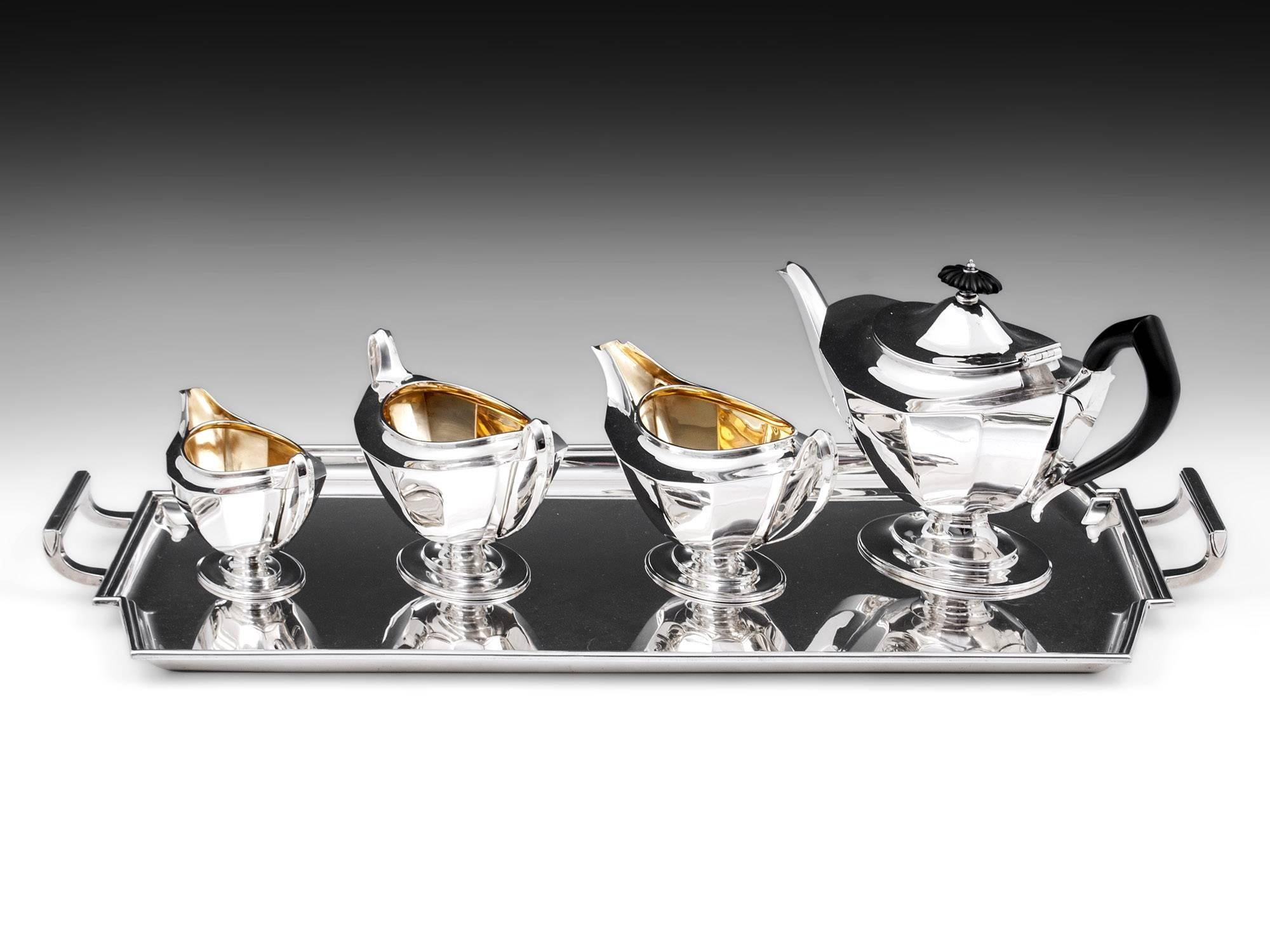 Art Deco sterling silver tea set of outstanding quality with Ebony handles, comprises of Tea pot, Water jug, Milk jug & Sugar bowl, all four pieces are superbly made and by Sheffield Silversmiths Harrison Brothers & Howson. Each piece is so typical