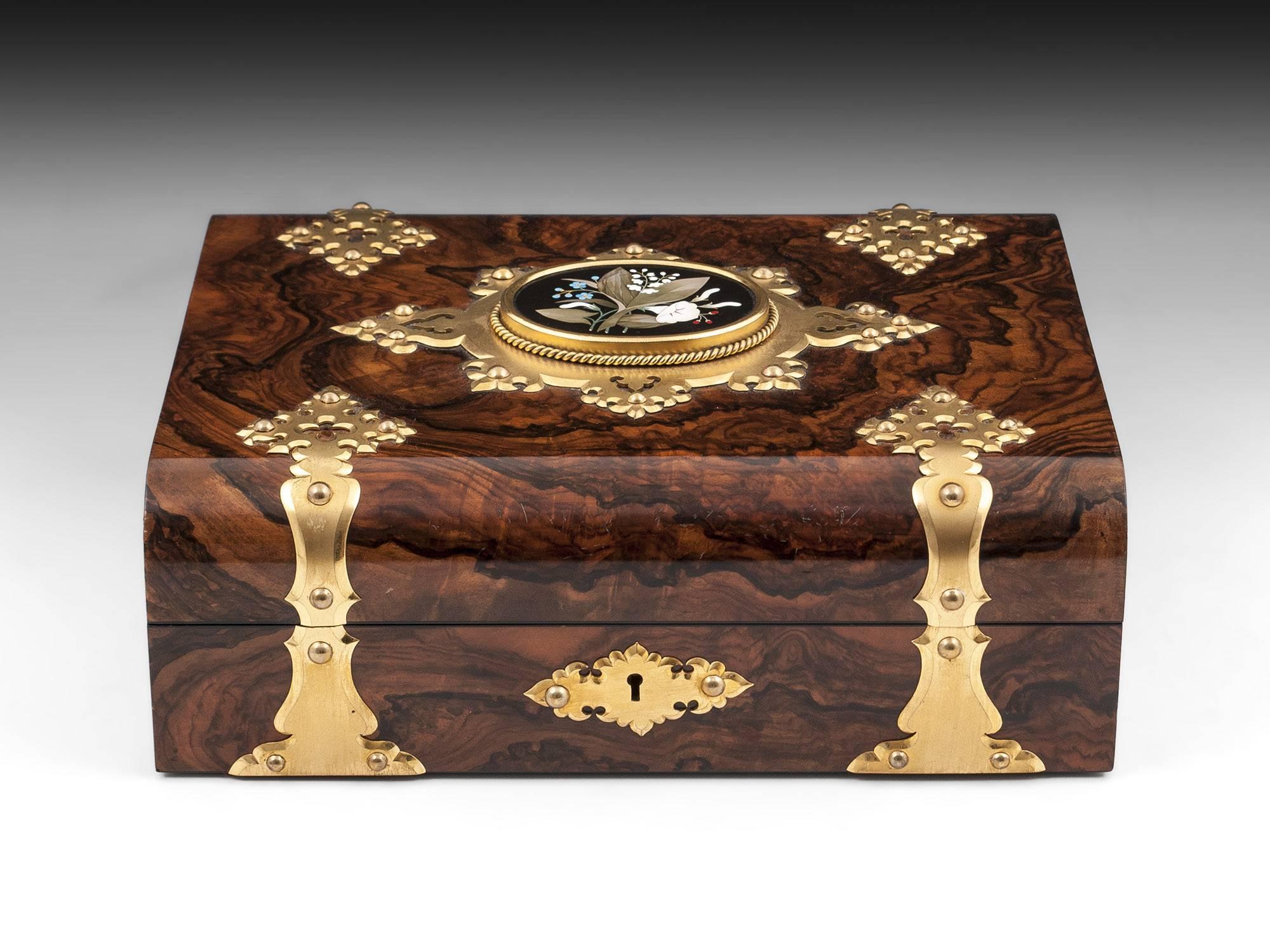 Antique feathered walnut Games Compendium with a wonderful Ashford Marble plaque beautifully made with a floral spray of flowers and framed with elaborated gilded mounts. 

The interior of this fabulous antique games box is fully fitted with