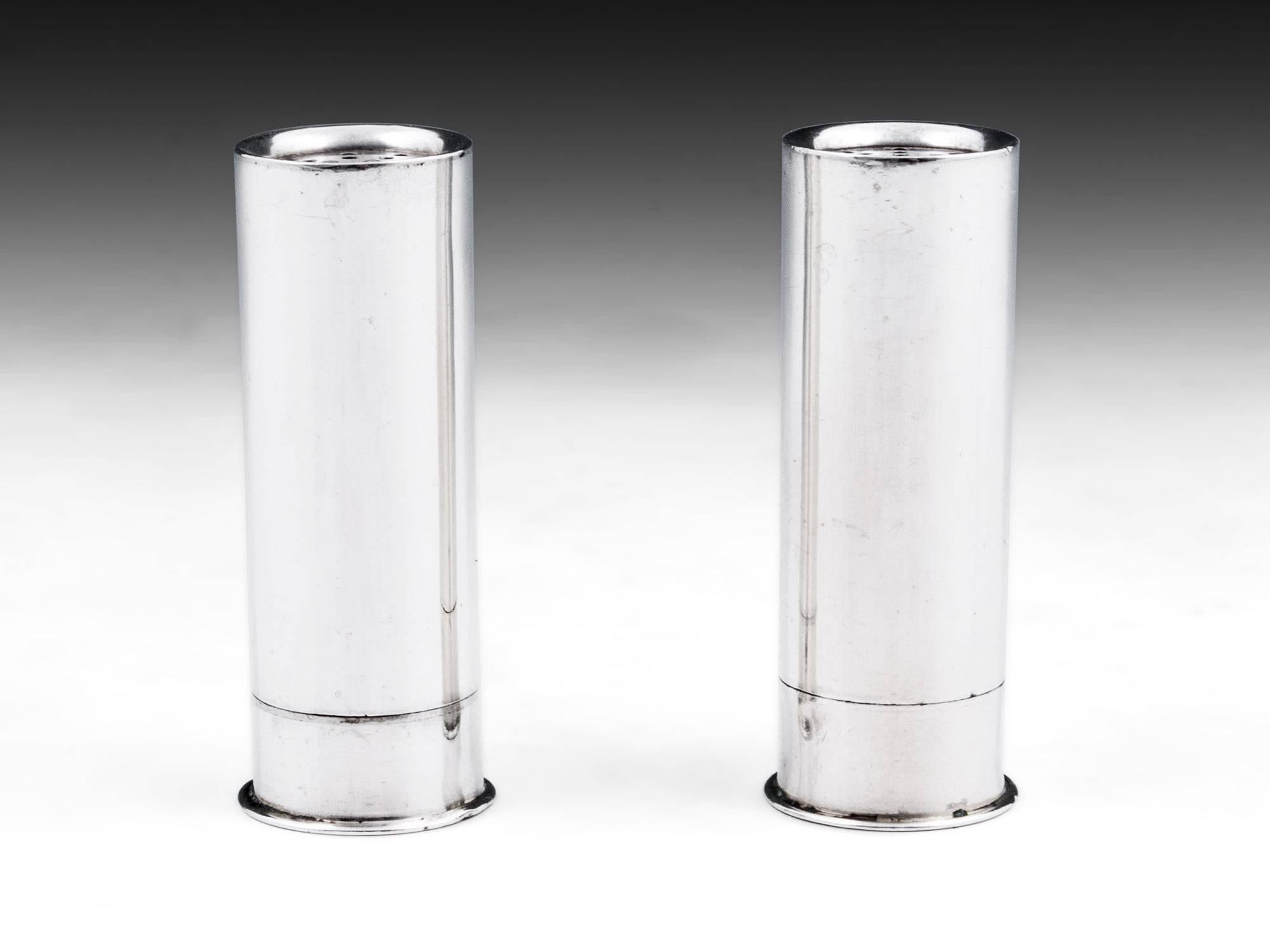 Sterling silver salt and pepper shakers in the form of shotgun cartridges by Birmingham Silversmiths Mappin & Webb.