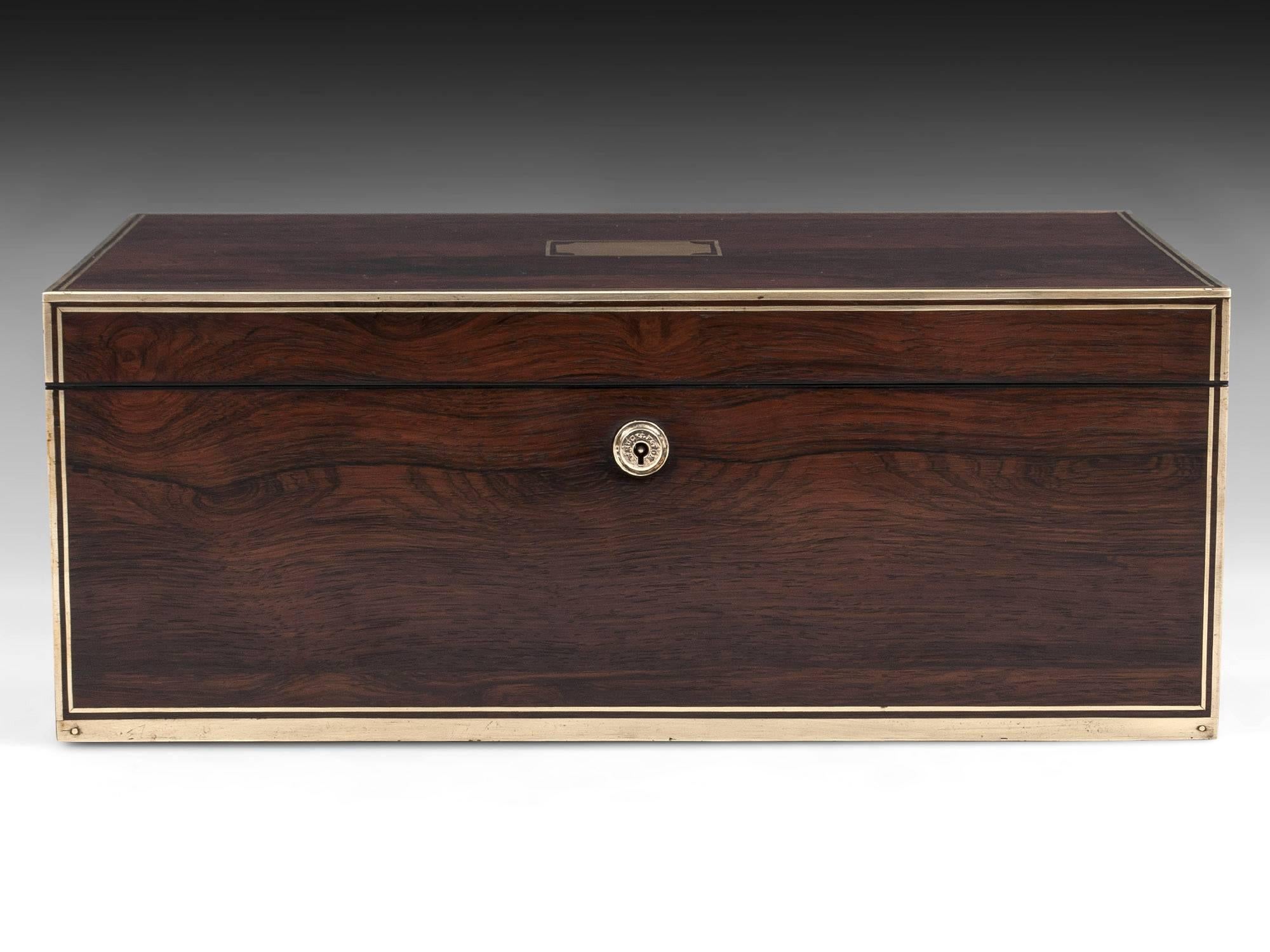 Antique Writing Box made by David Edwards who was awarded two royal warrants from King George IV and Queen Victoria. The fabulous writing box is veneered in figured mahogany with strong squared brass edging and stringing in the front and top. The